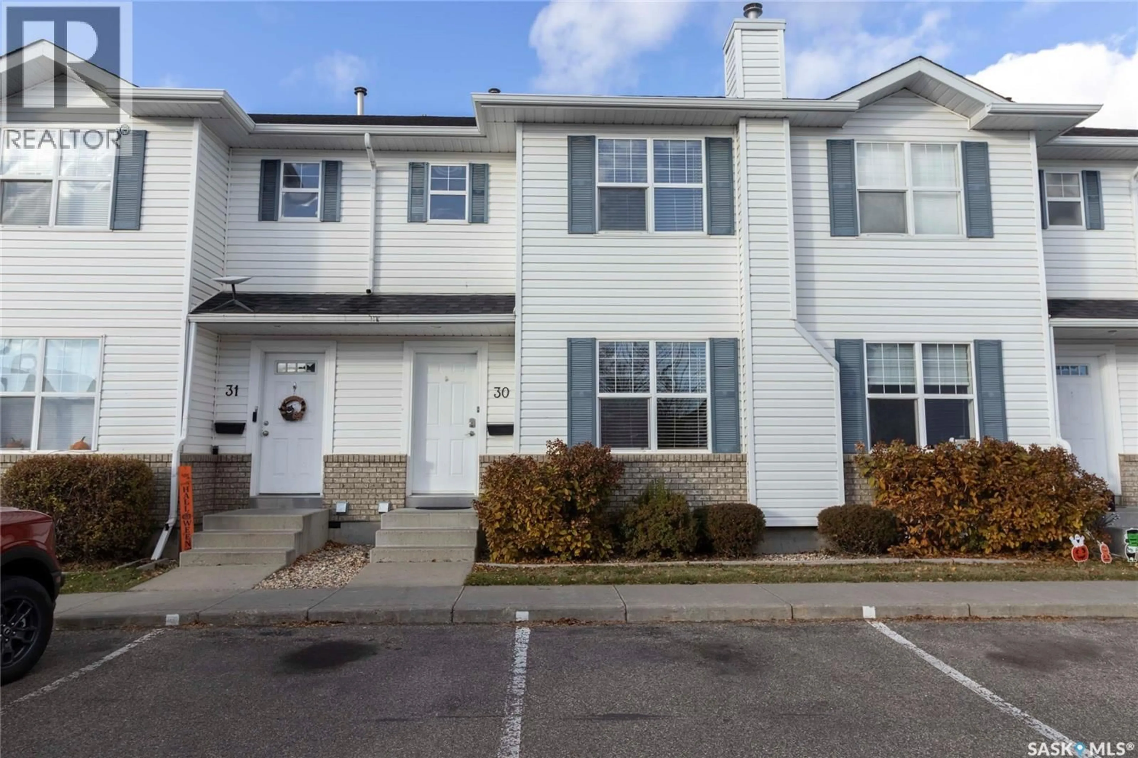 Home with vinyl exterior material, street for 30 203 HEROLD TERRACE, Saskatoon Saskatchewan S7V1H3