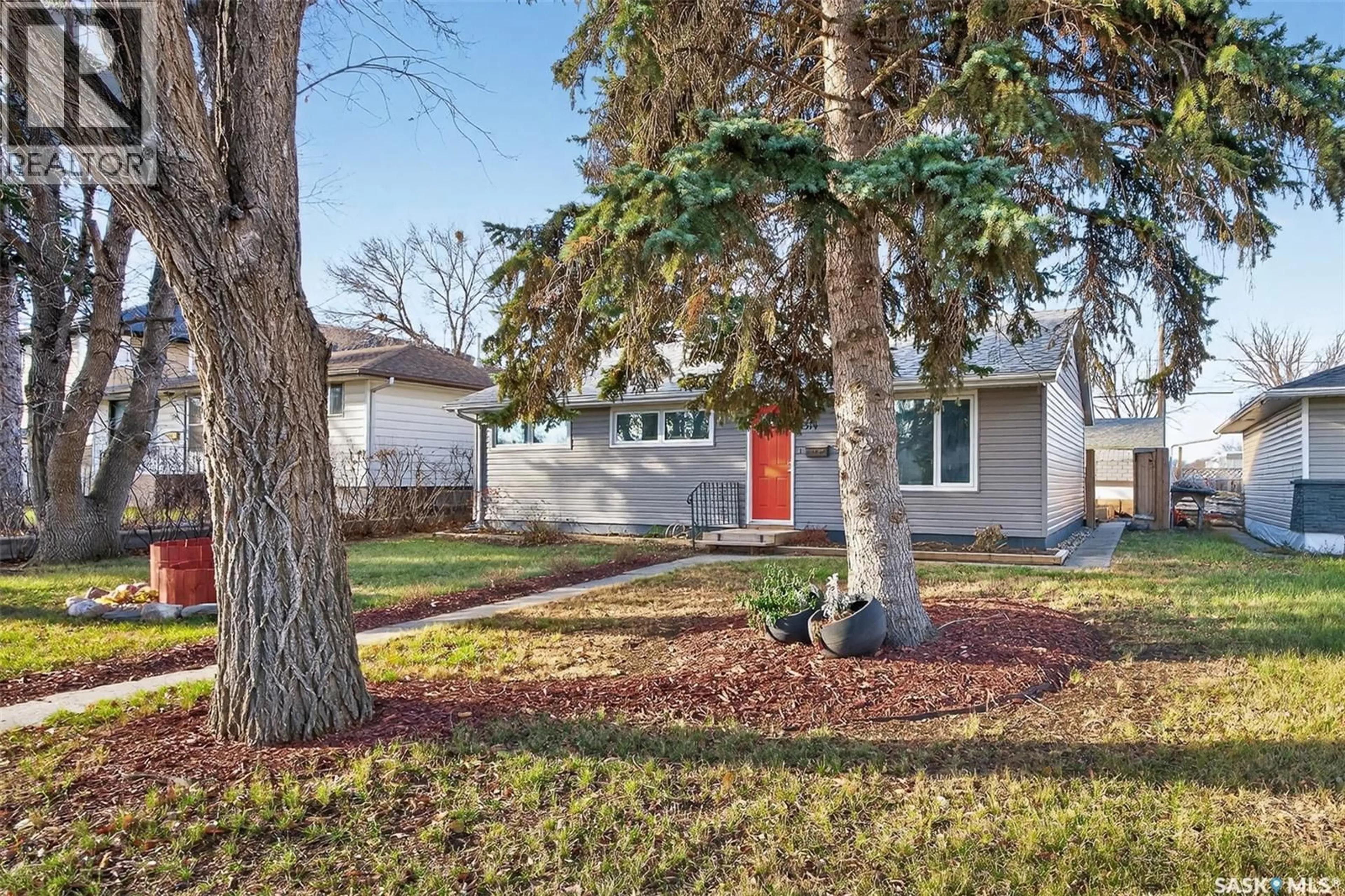 Home with vinyl exterior material, street for 1314 7TH AVENUE, Moose Jaw Saskatchewan S6H4C9