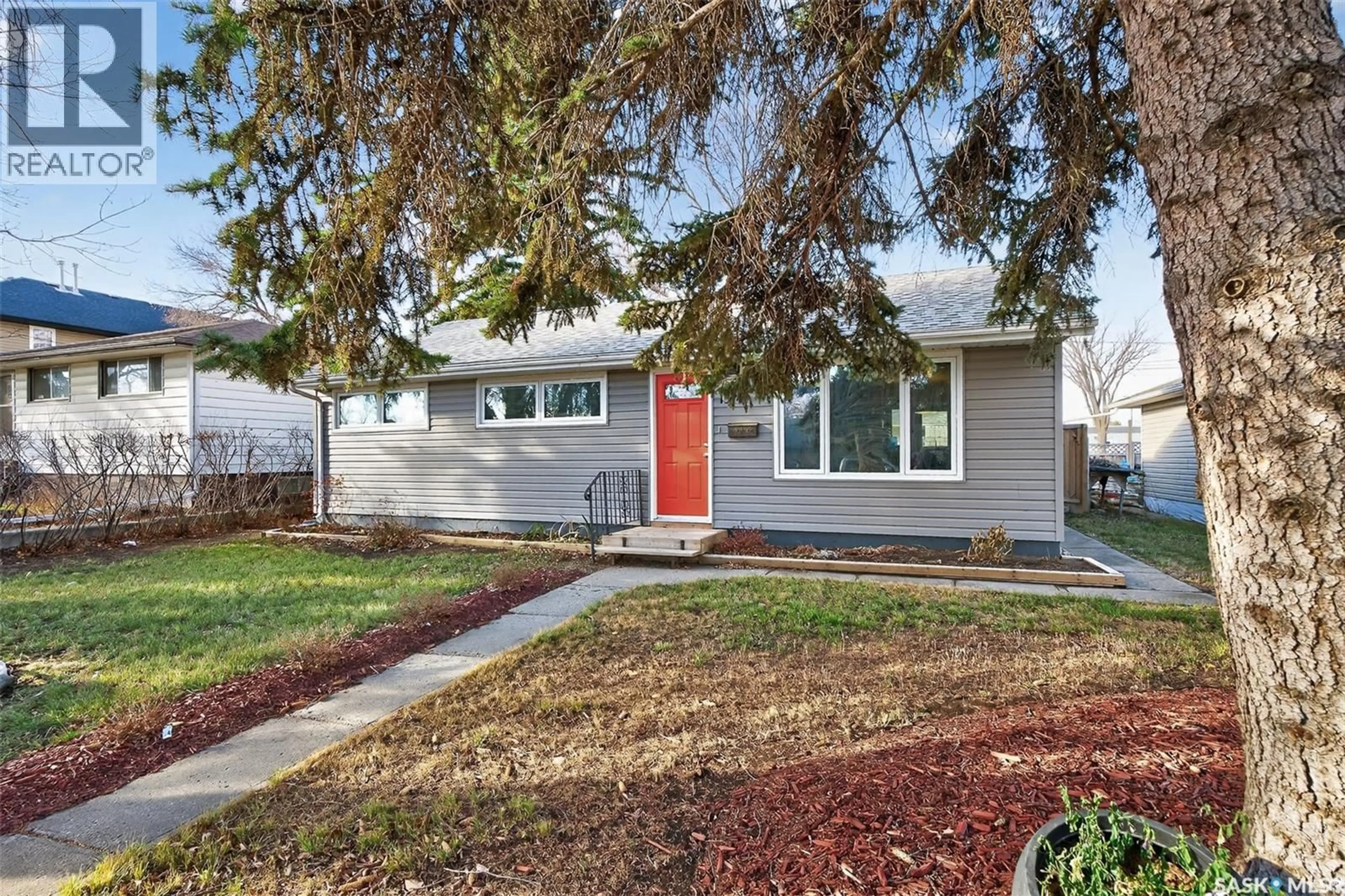 Home with vinyl exterior material, street for 1314 7TH AVENUE, Moose Jaw Saskatchewan S6H4C9