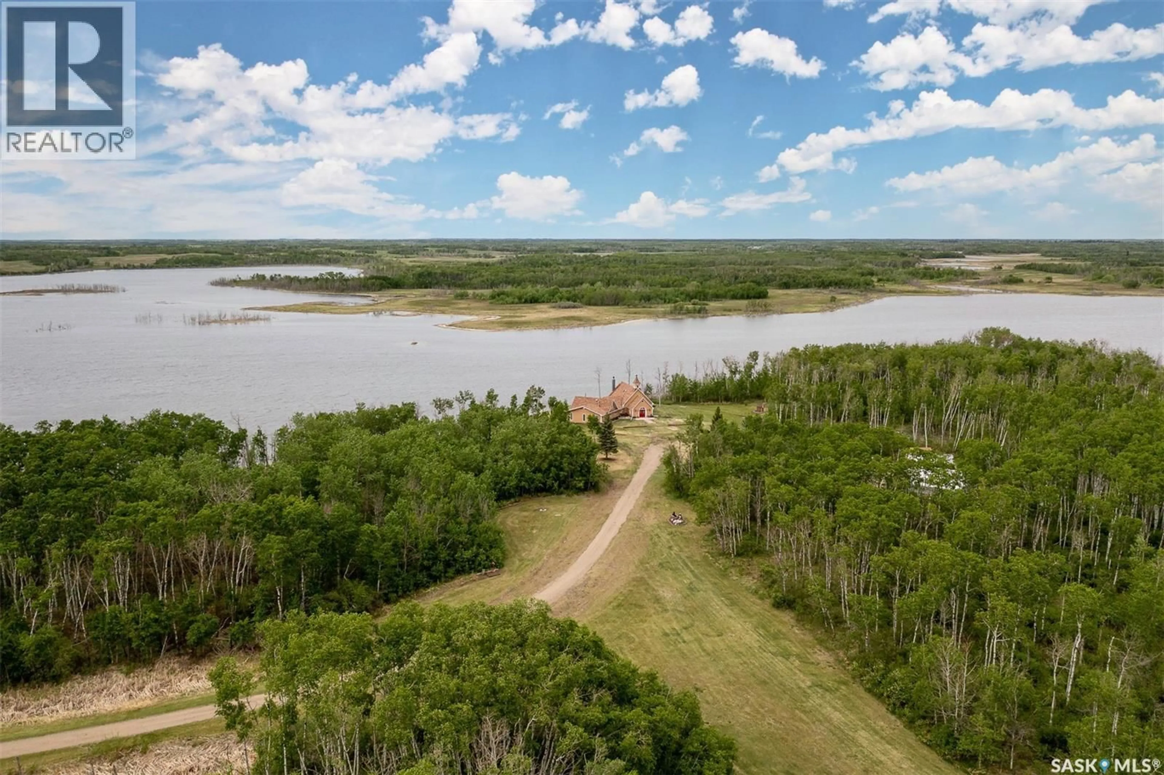 A pic from outside/outdoor area/front of a property/back of a property/a pic from drone, water/lake/river/ocean view for ROSE ACREAGE, Duck Lake Rm No. 463 Saskatchewan S0K1J0