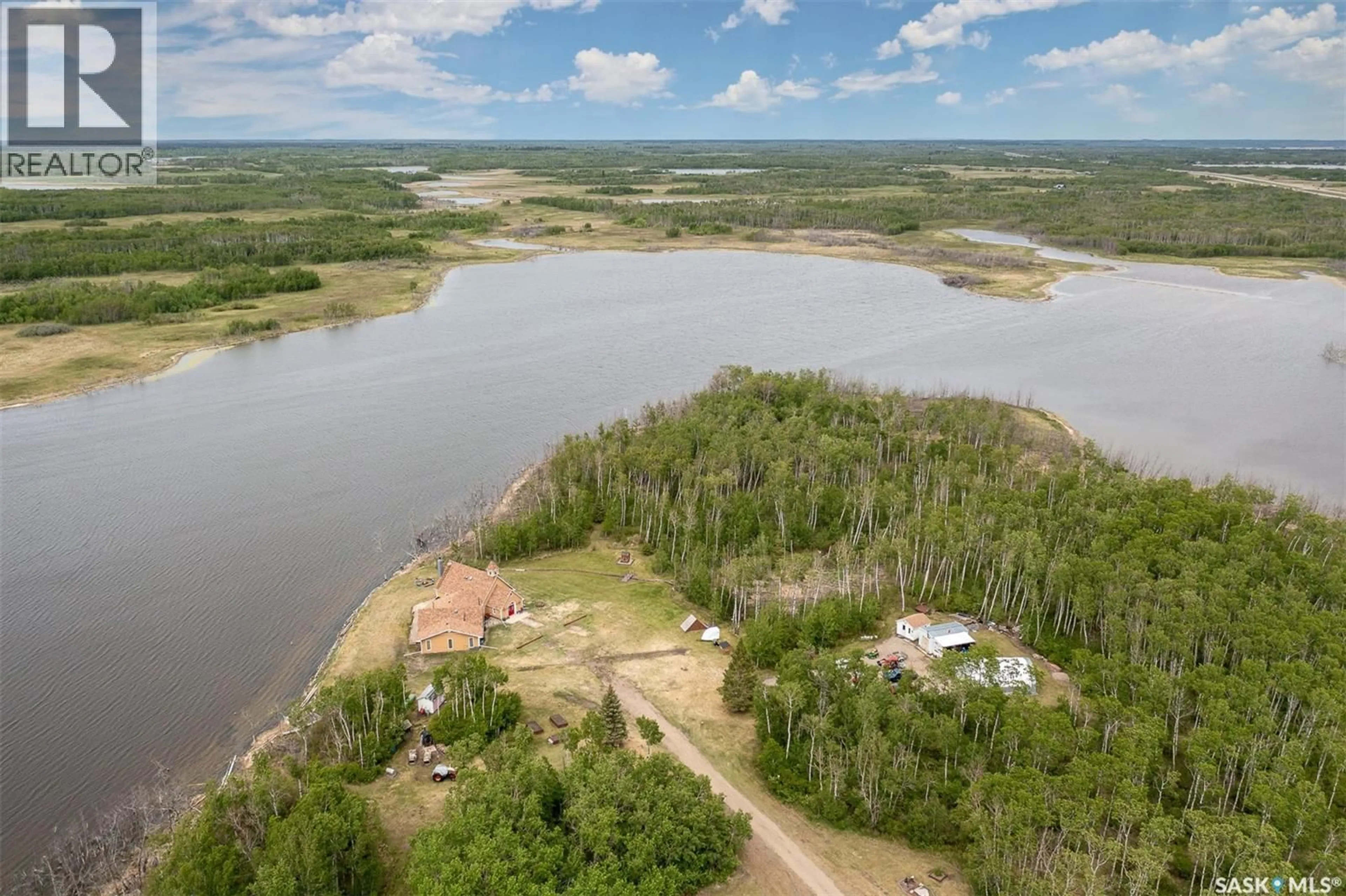 A pic from outside/outdoor area/front of a property/back of a property/a pic from drone, water/lake/river/ocean view for ROSE ACREAGE, Duck Lake Rm No. 463 Saskatchewan S0K1J0