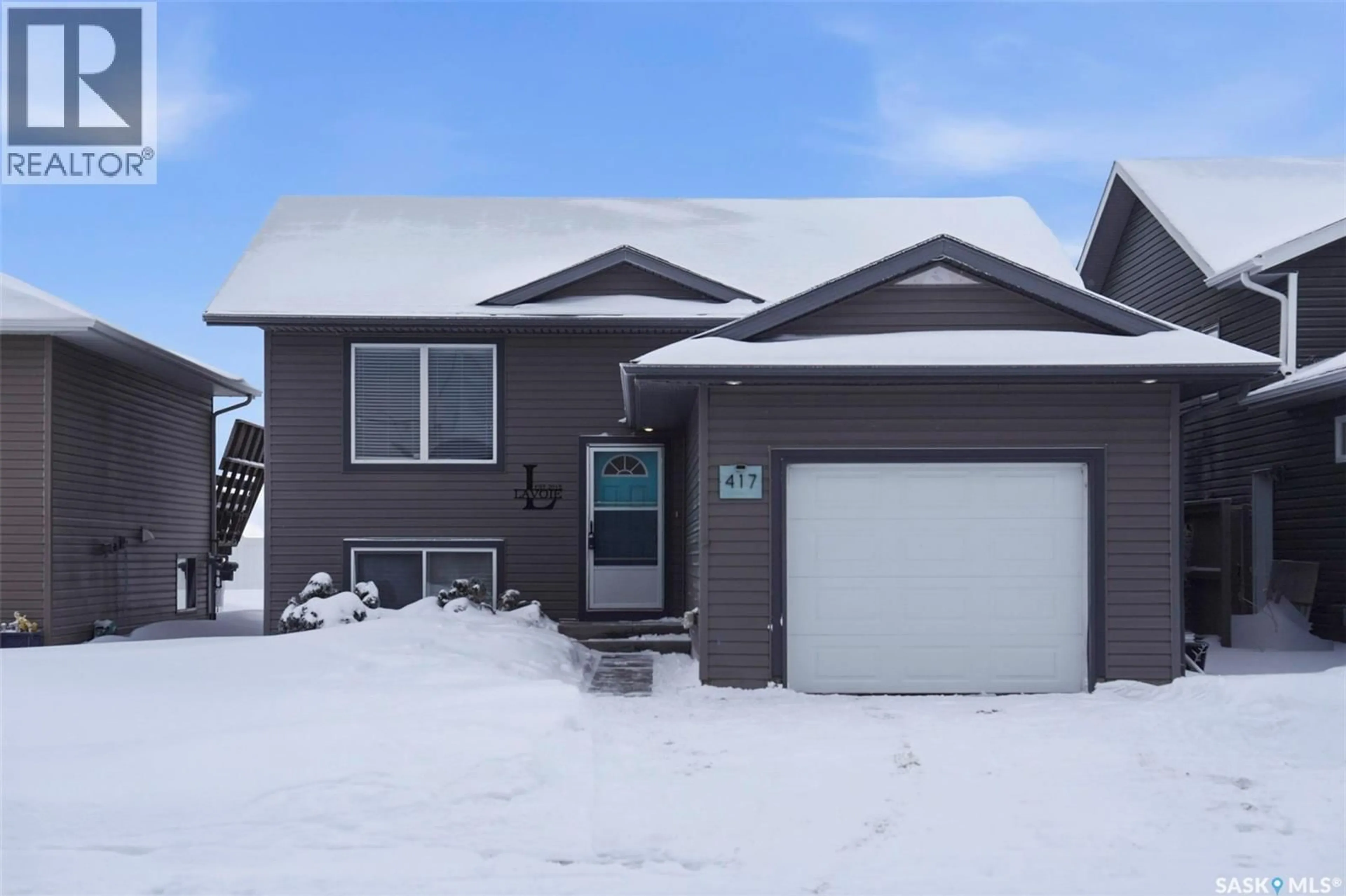 Home with vinyl exterior material, street for 417 MARTENS STREET, Warman Saskatchewan S0K4S3