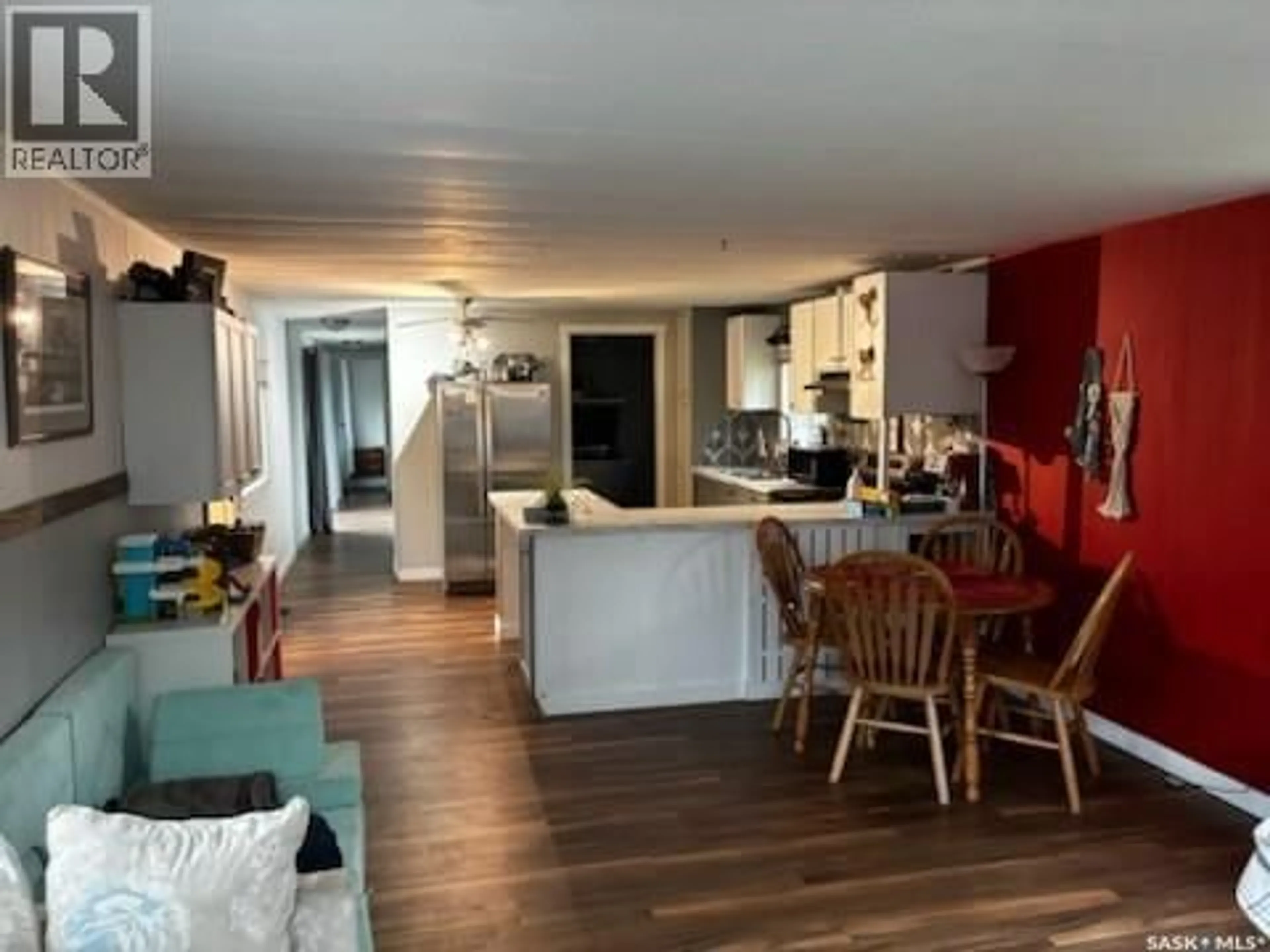 Open concept kitchen, wood/laminate floor for 124 DOGWOOD STREET, Caronport Saskatchewan S0H0S0