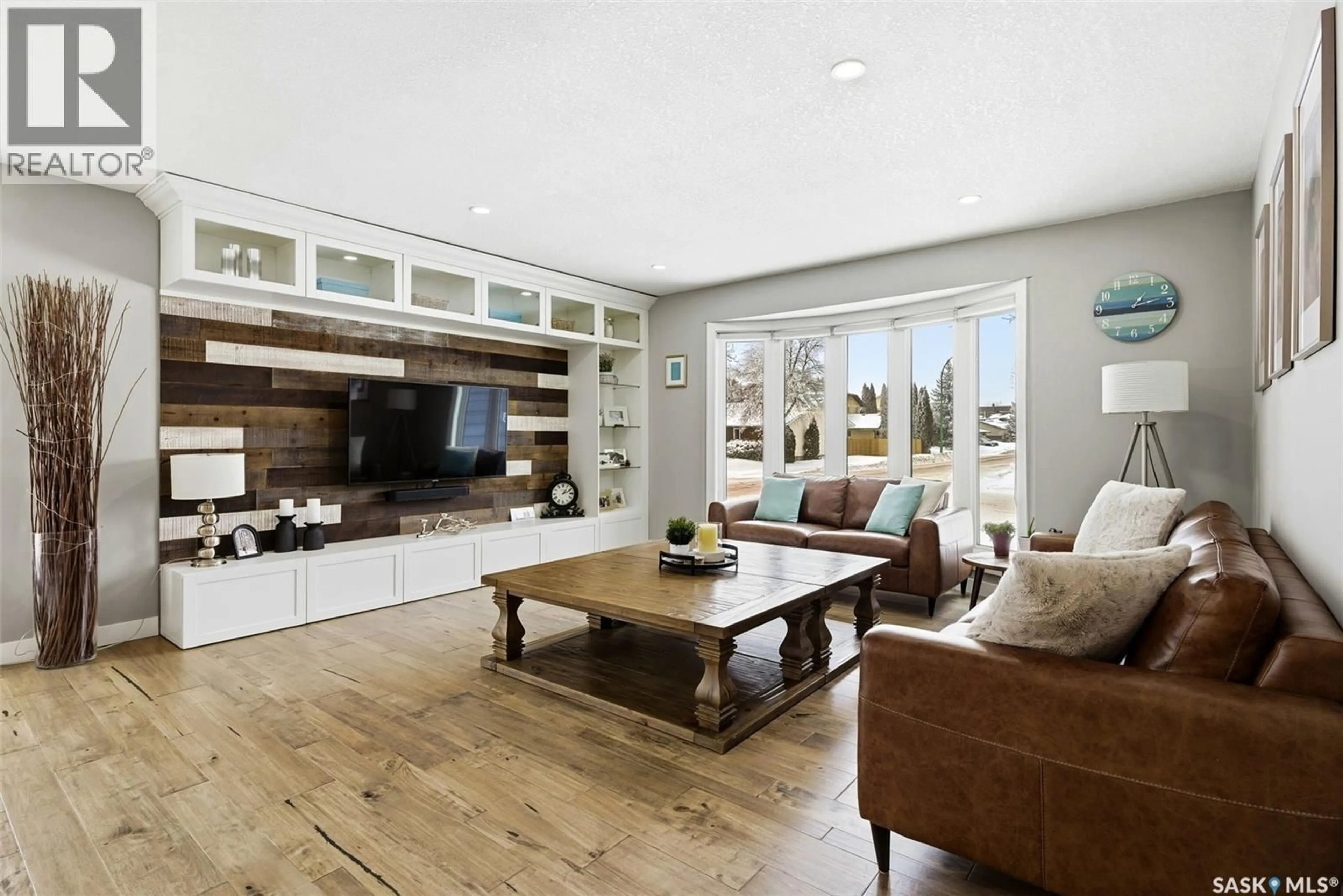 Living room with furniture, wood/laminate floor for 3203 MARGARET ROAD, Regina Saskatchewan S4V1B2