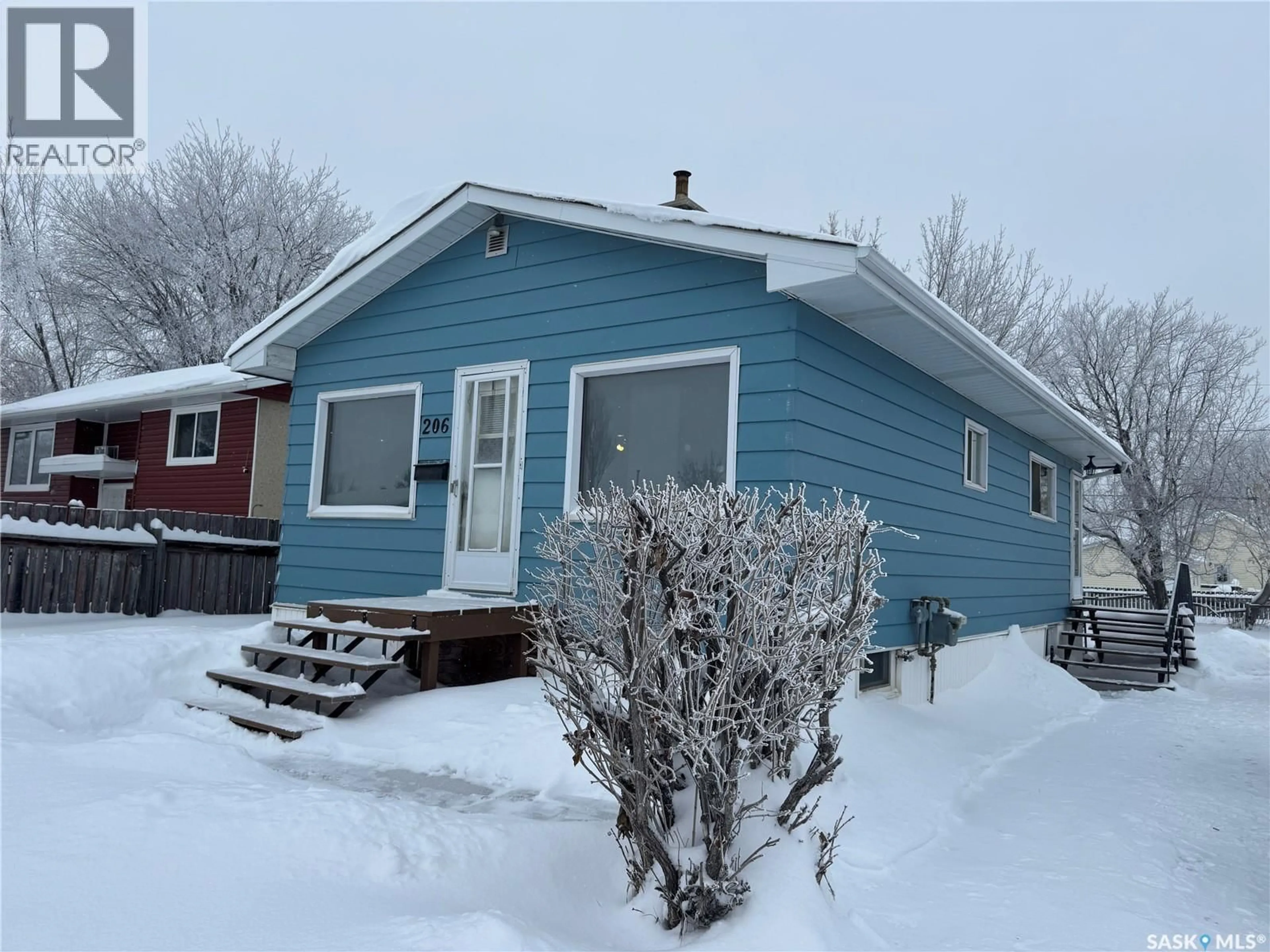 Home with vinyl exterior material, street for 206 31ST STREET, Prince Albert Saskatchewan S6V2A1
