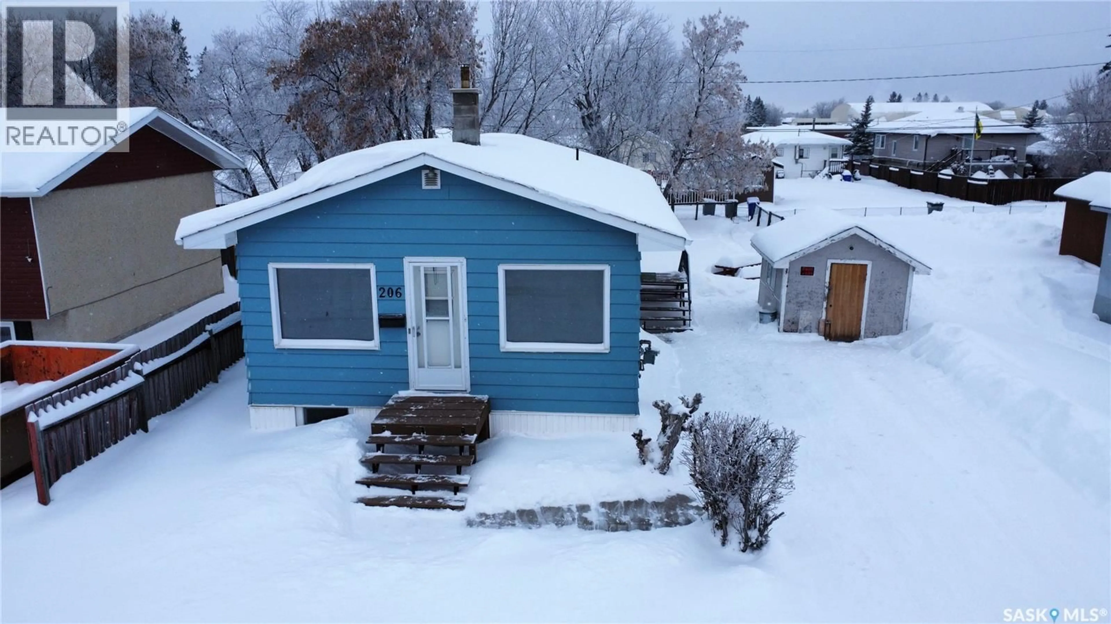 A pic from outside/outdoor area/front of a property/back of a property/a pic from drone, street for 206 31ST STREET, Prince Albert Saskatchewan S6V2A1