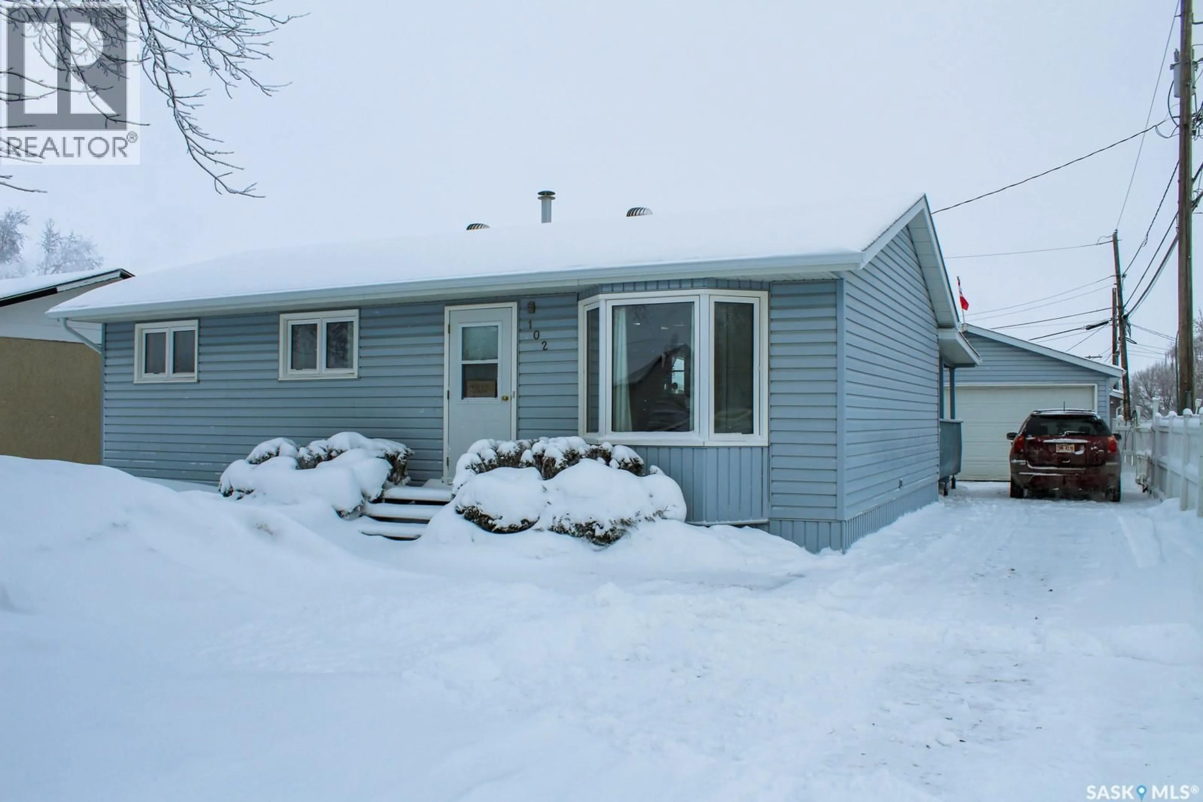 Home with vinyl exterior material, street for 102 OSBORNE STREET, Melfort Saskatchewan S0E1A0