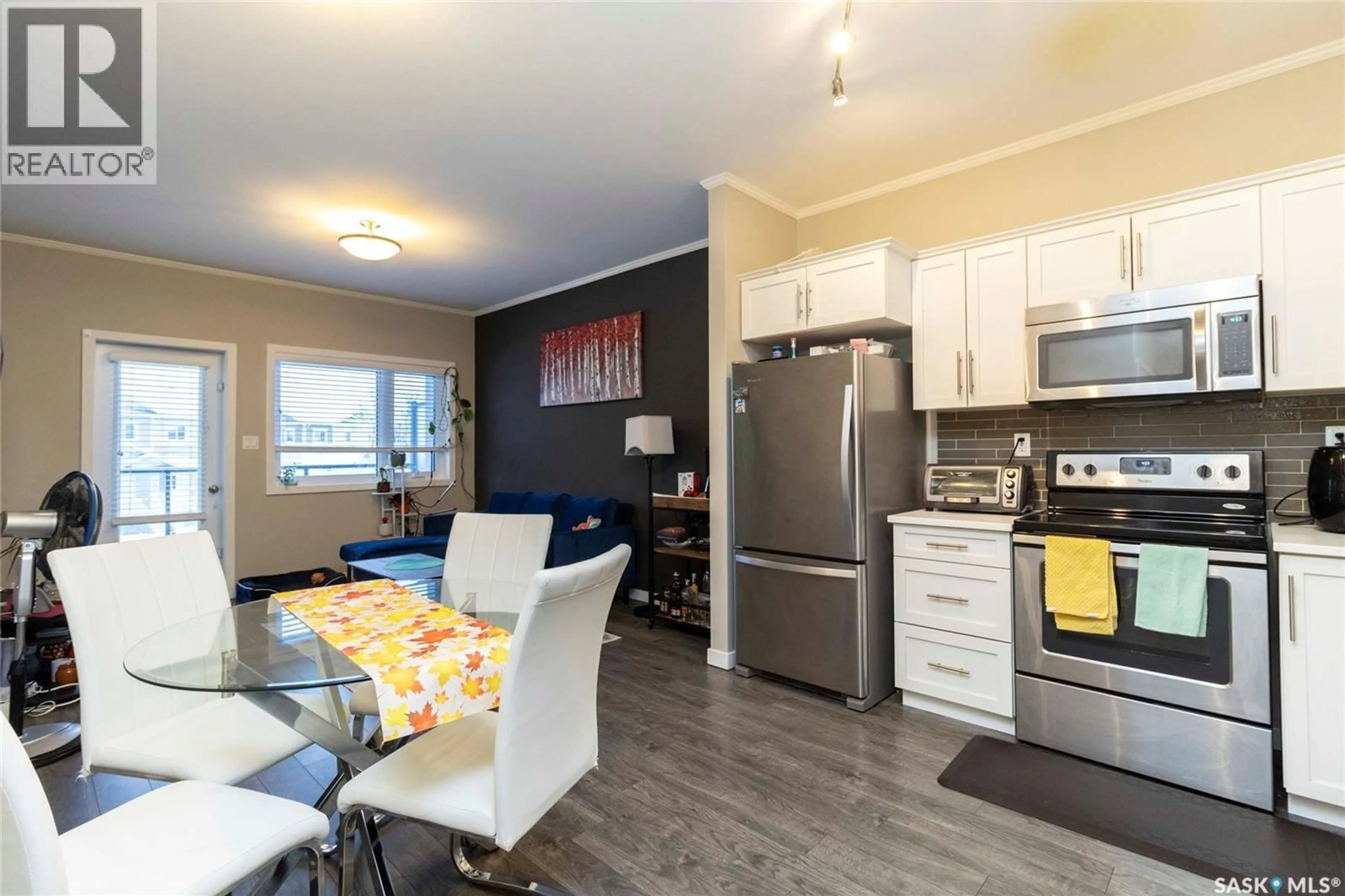 Open concept kitchen, wood/laminate floor for 207 - 720 BALTZAN TERRACE, Saskatoon Saskatchewan S7W0W6