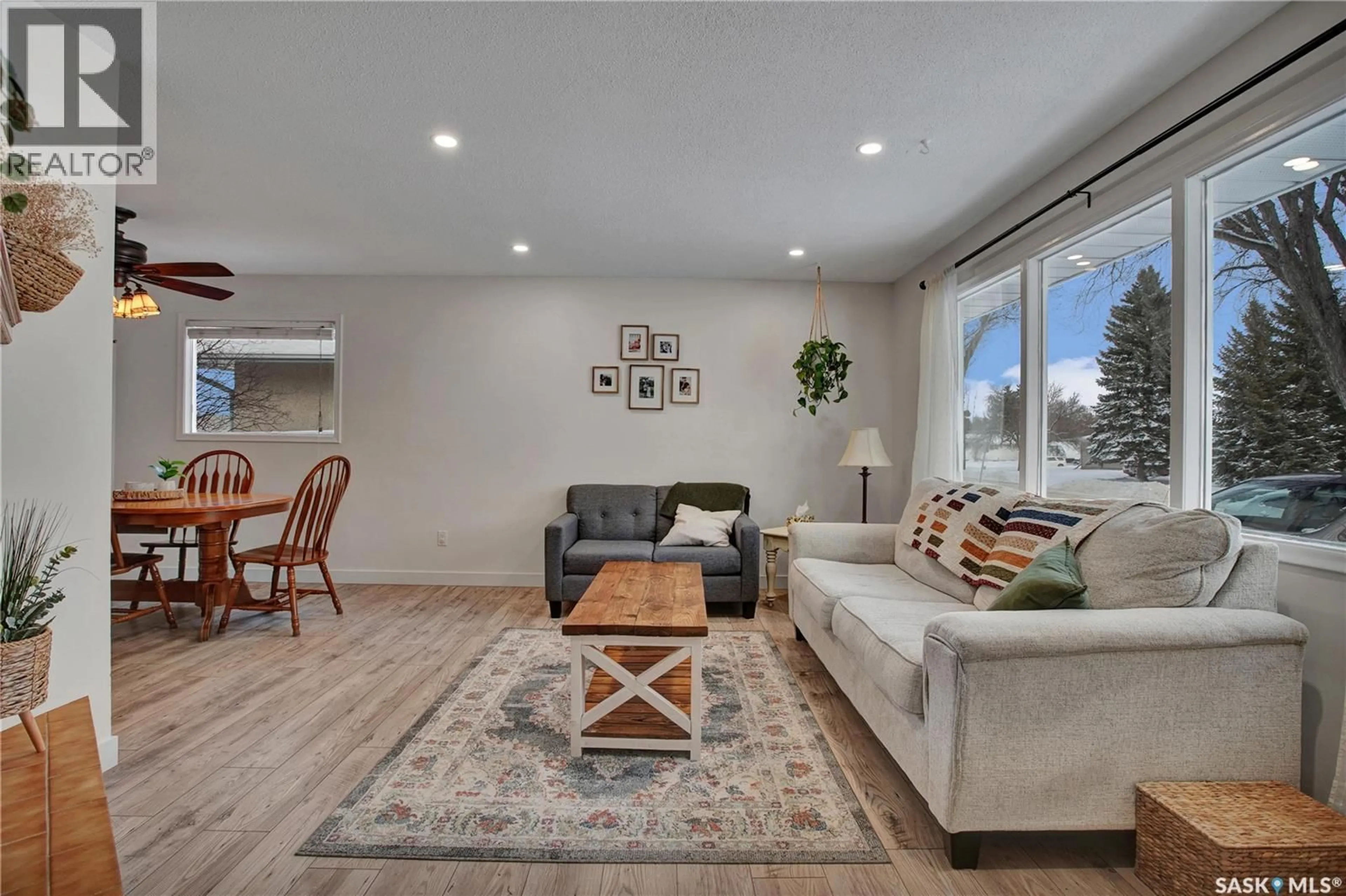 Living room with furniture, wood/laminate floor for 1814 RICHARDSON ROAD, Saskatoon Saskatchewan S7L4B5