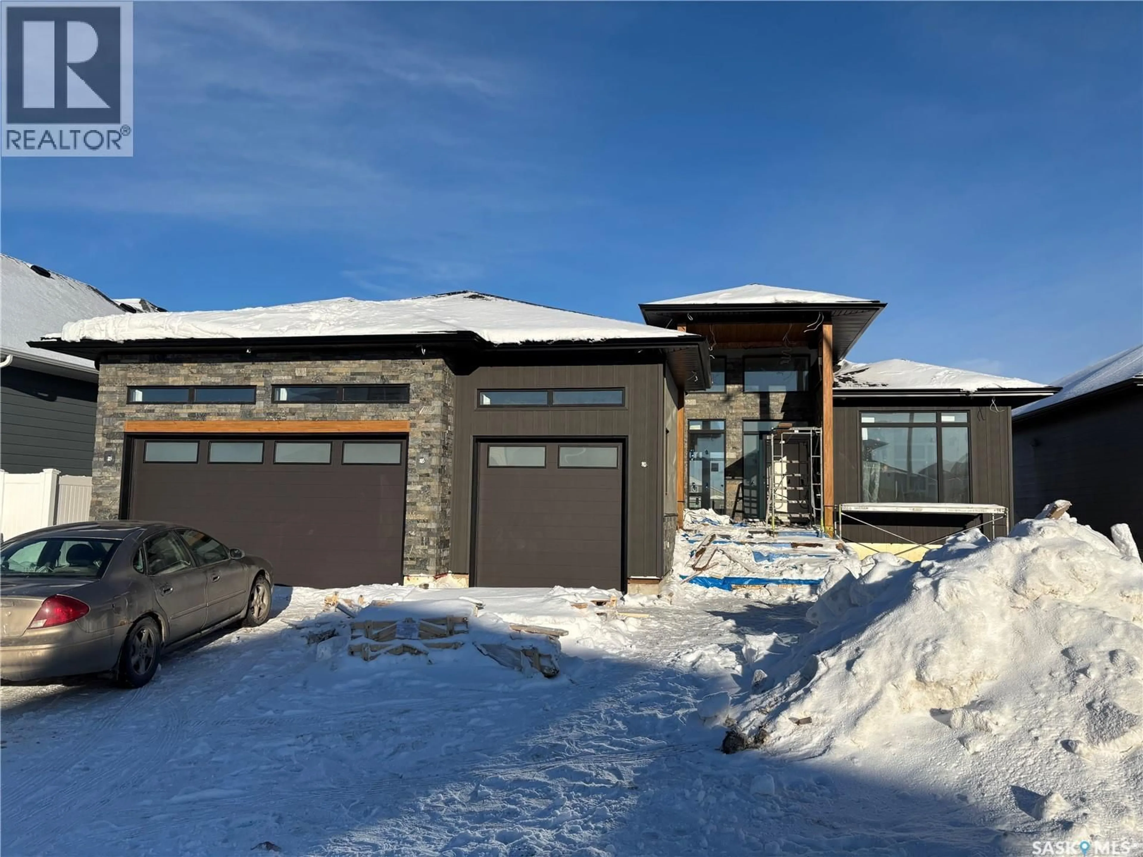 Home with brick exterior material, street for 216 SETTLER CRESCENT, Warman Saskatchewan S0K4S4