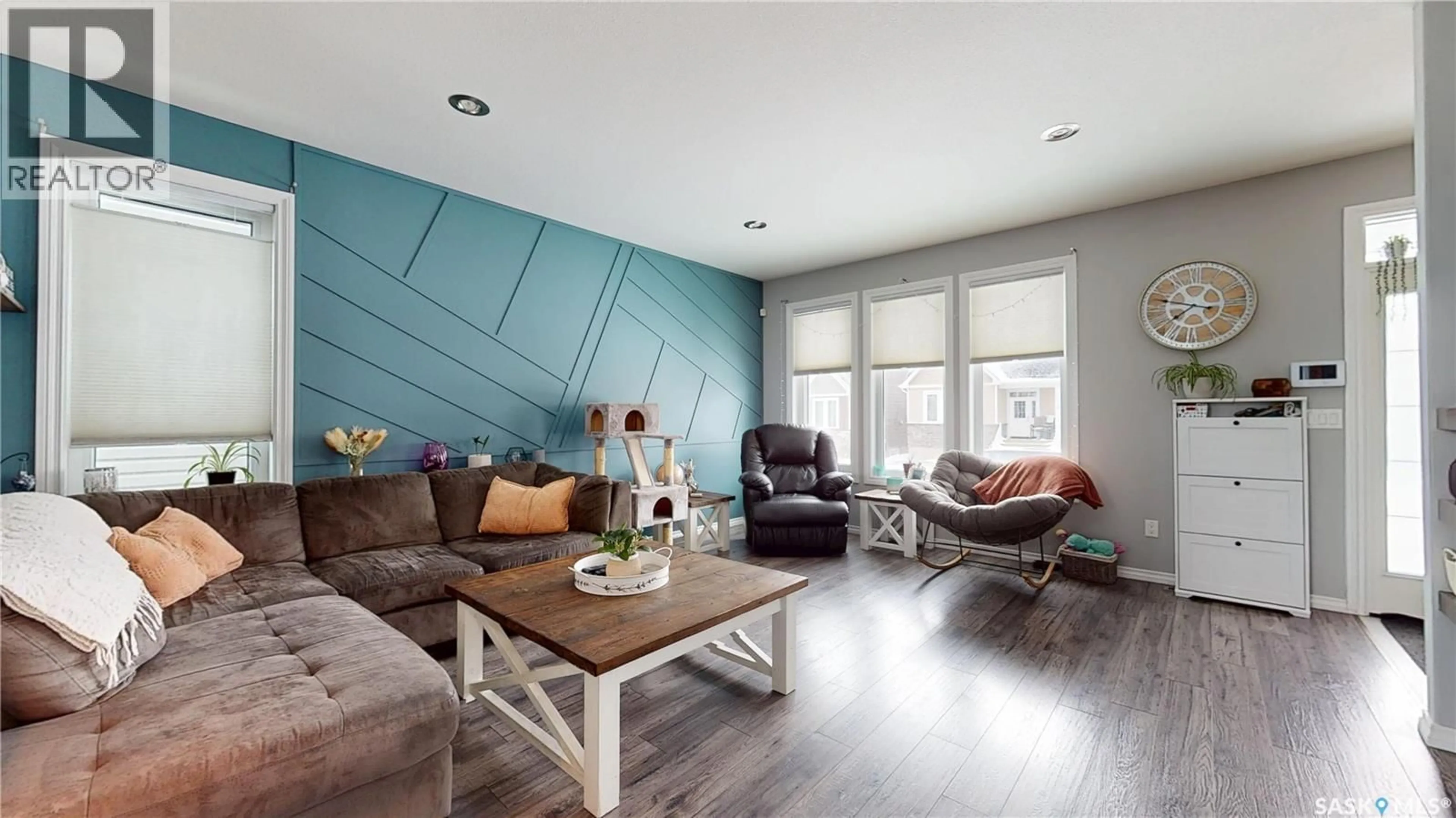 Living room with furniture, wood/laminate floor for 1117 JURASIN STREET, Regina Saskatchewan S4X0K1