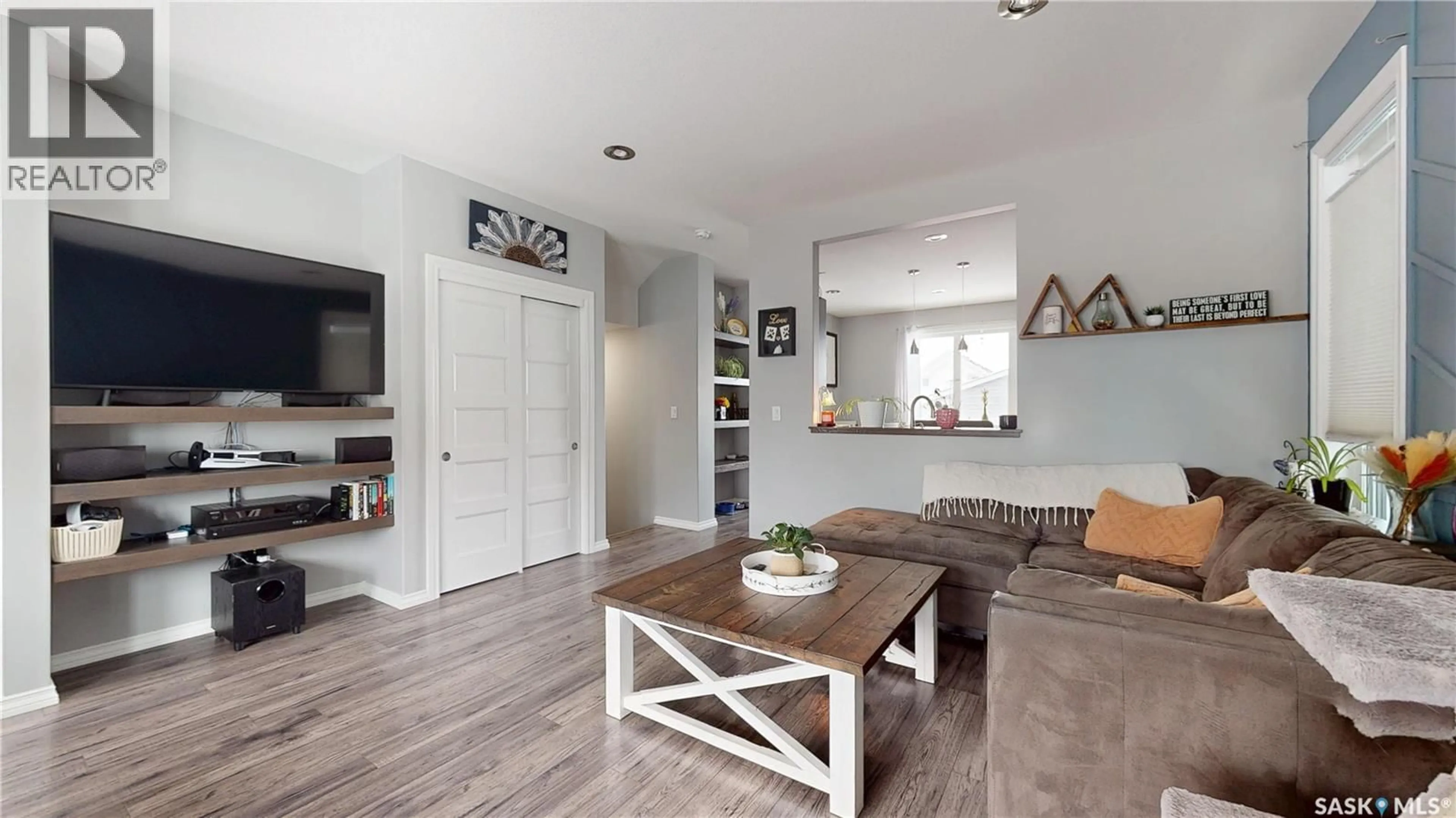 Living room with furniture, wood/laminate floor for 1117 JURASIN STREET, Regina Saskatchewan S4X0K1