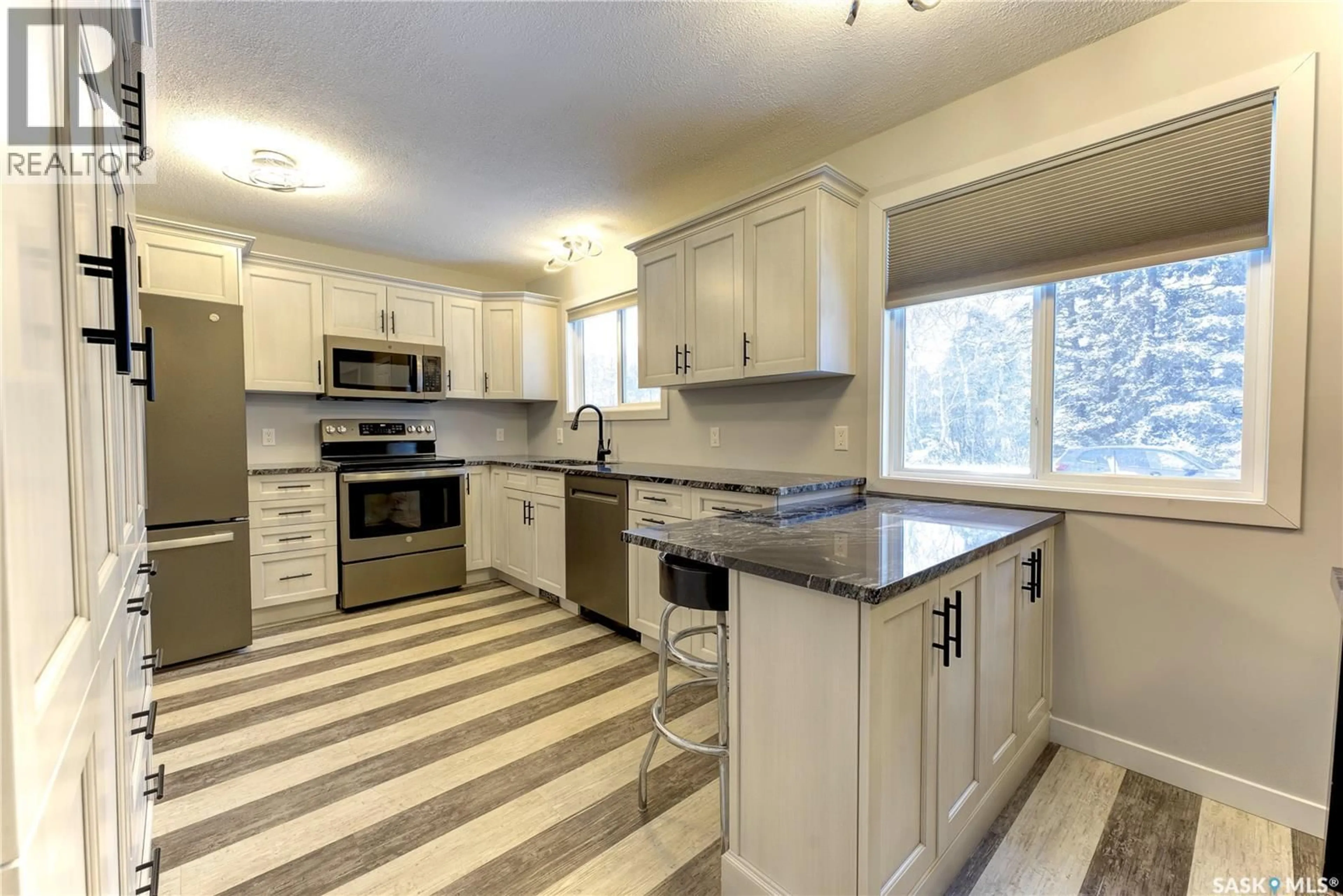 Open concept kitchen, ceramic/tile floor for 123 4TH STREET, Pierceland Saskatchewan S0M2K0