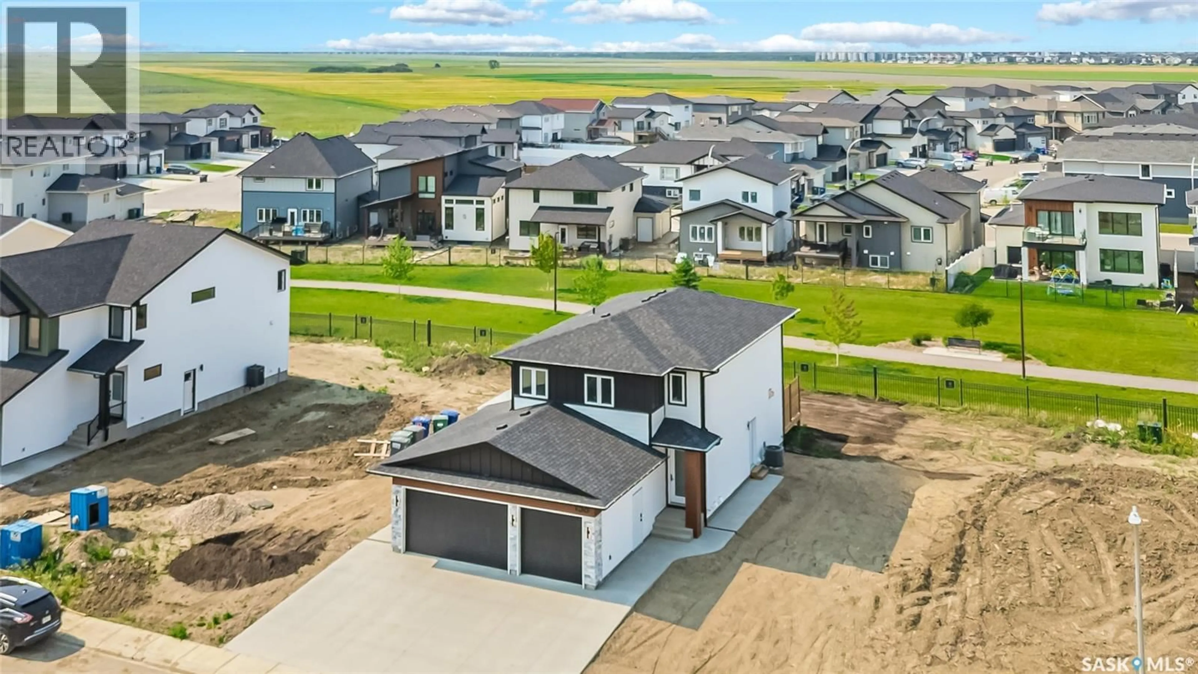 A pic from outside/outdoor area/front of a property/back of a property/a pic from drone, unknown for 158 HAVERSTOCK CRESCENT, Saskatoon Saskatchewan S7W1E3