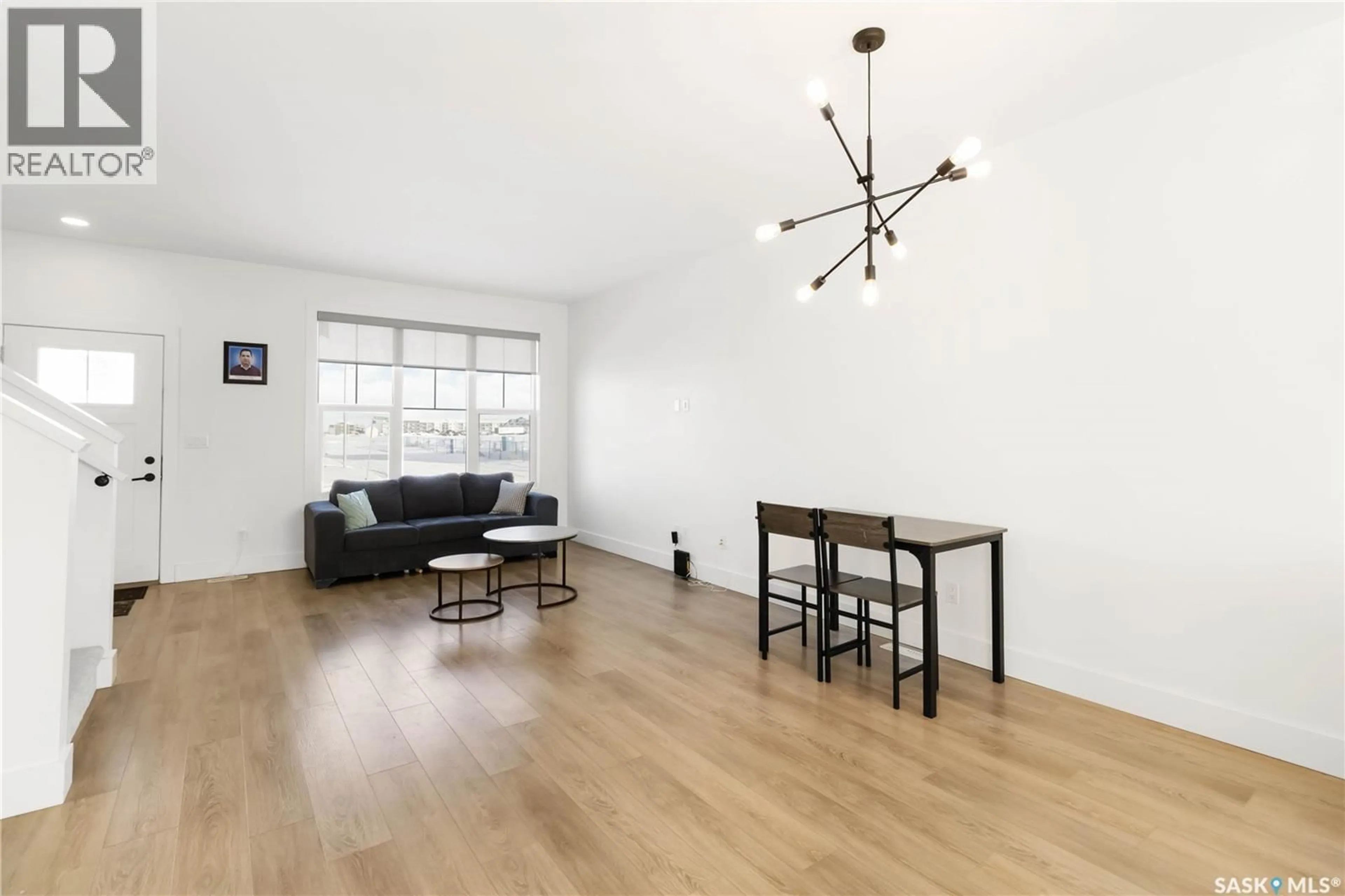 Living room with furniture, wood/laminate floor for 120 ROSEWOOD BOULEVARD, Saskatoon Saskatchewan S7V0Y9