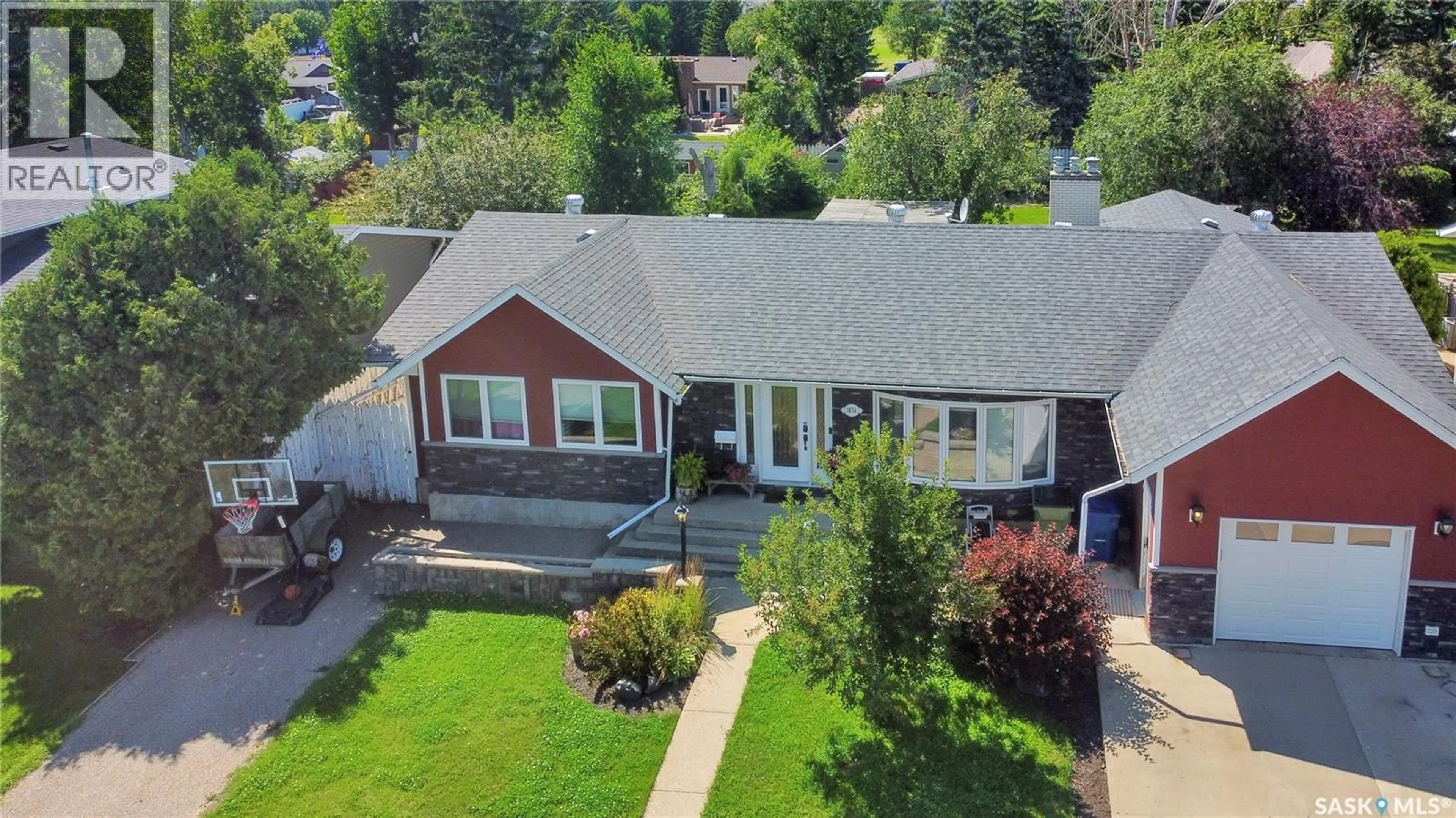A pic from outside/outdoor area/front of a property/back of a property/a pic from drone, street for 1614 11TH AVENUE, Moose Jaw Saskatchewan S6H6W9