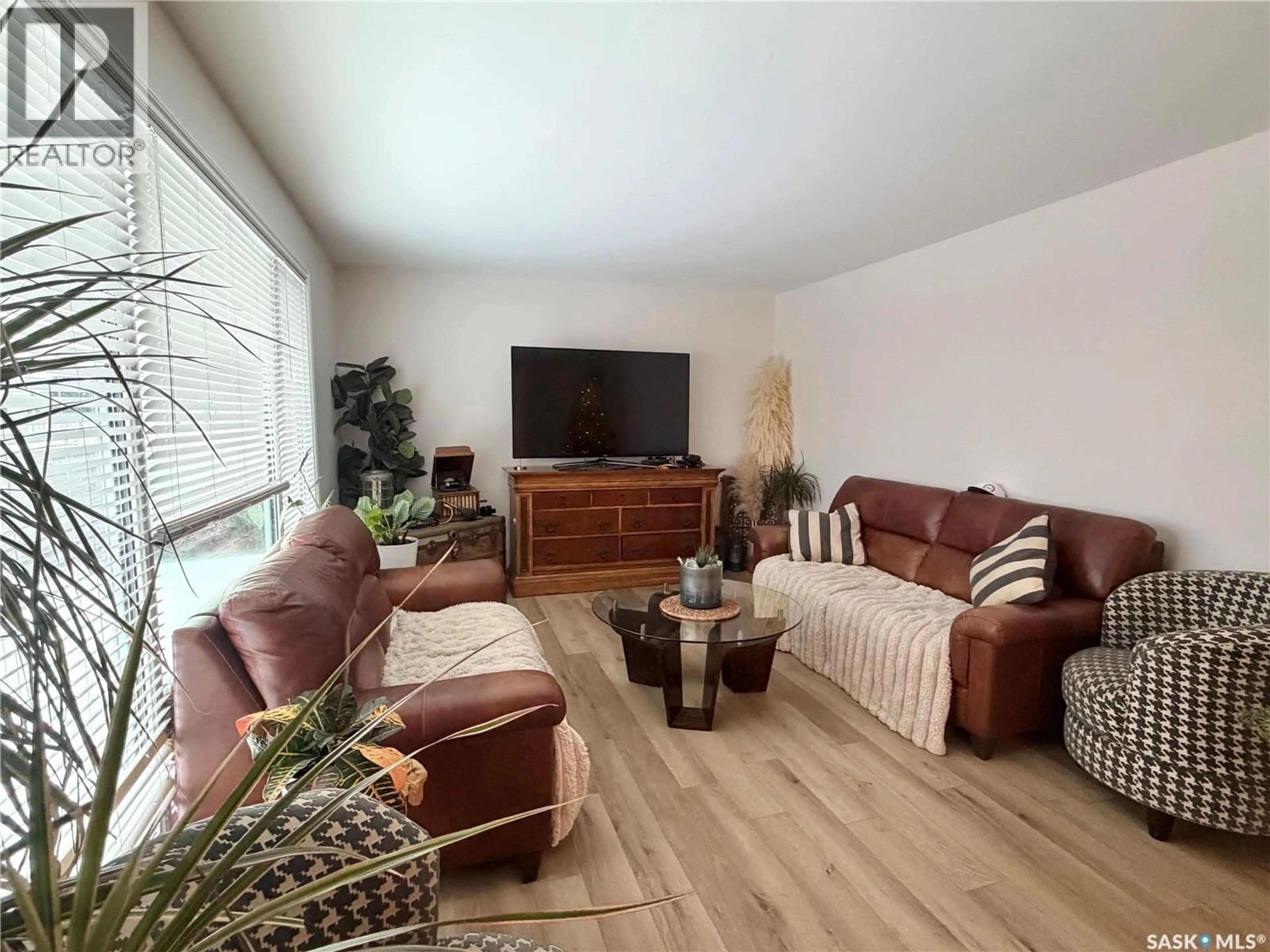 Living room with furniture, wood/laminate floor for 202 19TH STREET, Battleford Saskatchewan S0M0E0