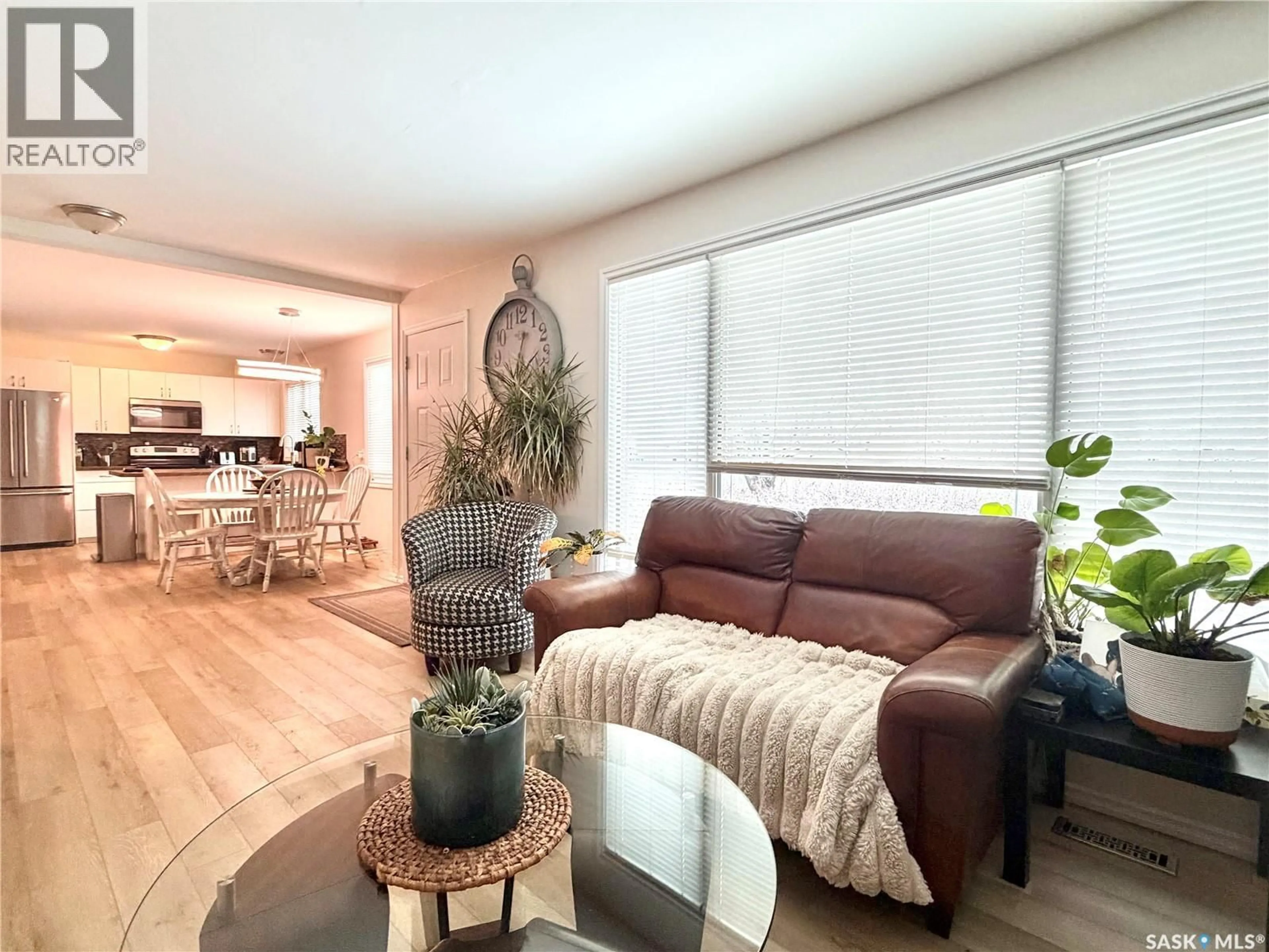 Living room with furniture, wood/laminate floor for 202 19TH STREET, Battleford Saskatchewan S0M0E0