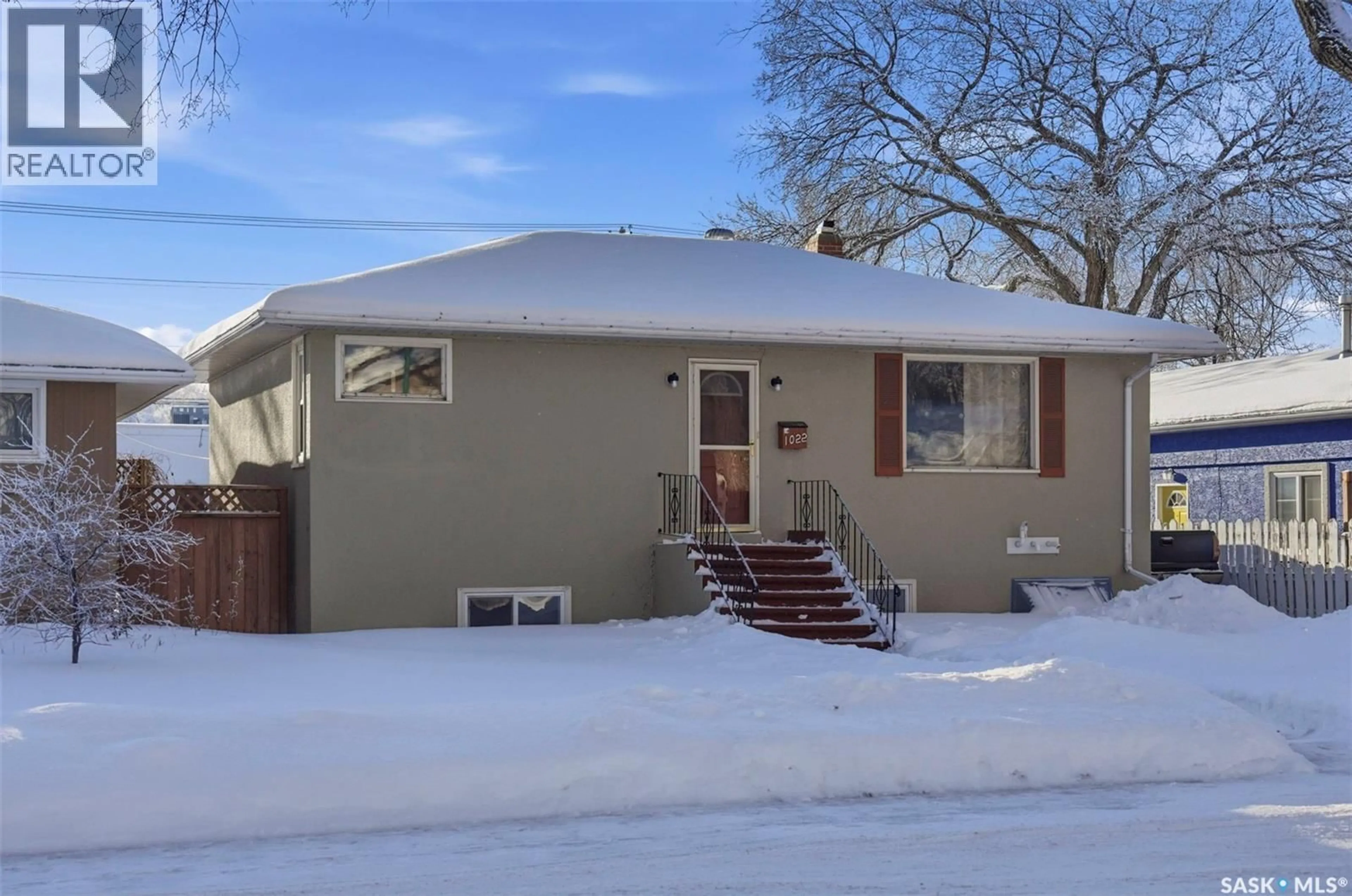 Home with vinyl exterior material, street for 1022 9TH STREET, Saskatoon Saskatchewan S7H0N2