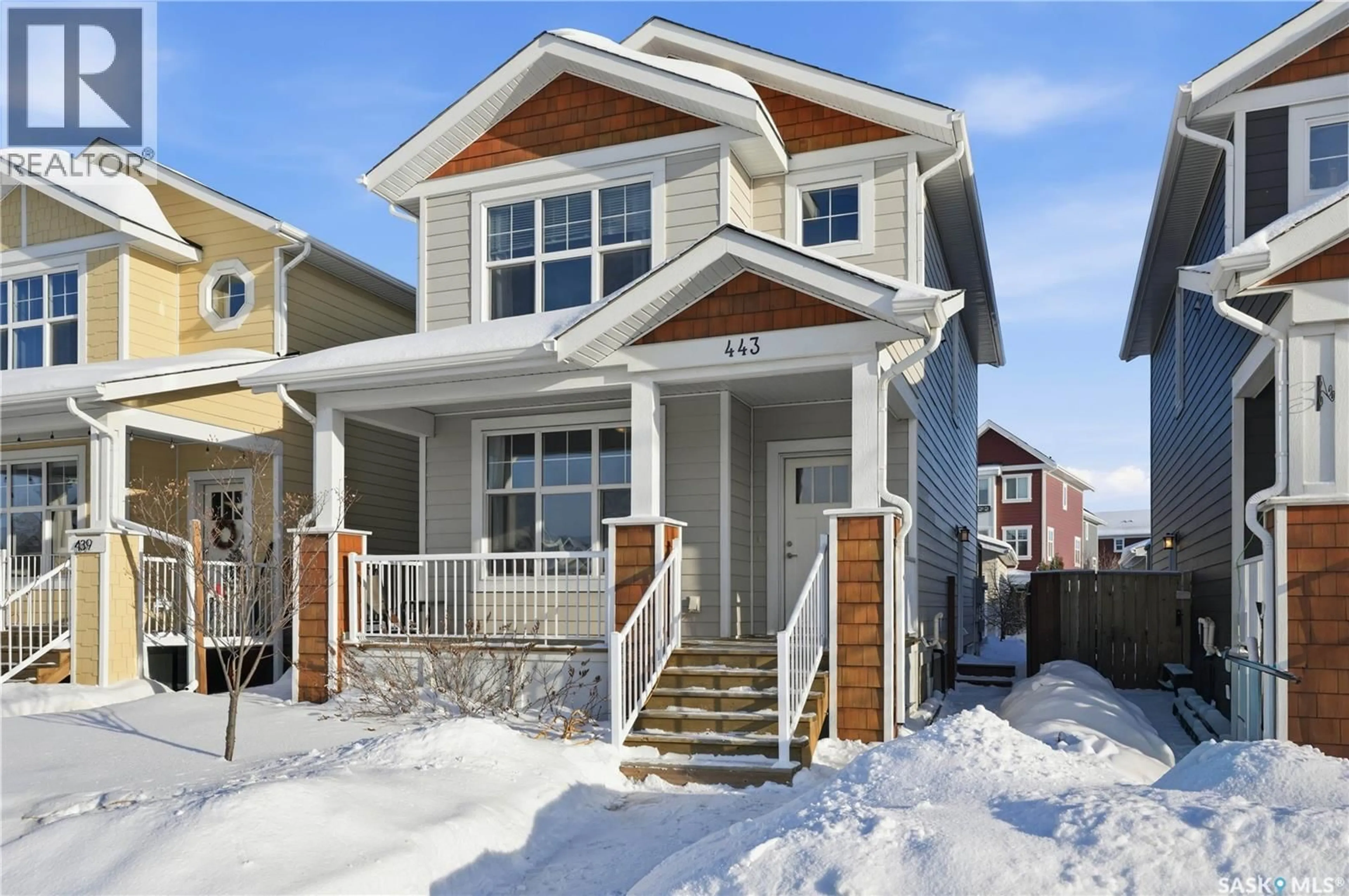 Home with vinyl exterior material, street for 443 EATON LANE, Saskatoon Saskatchewan S7V0A4