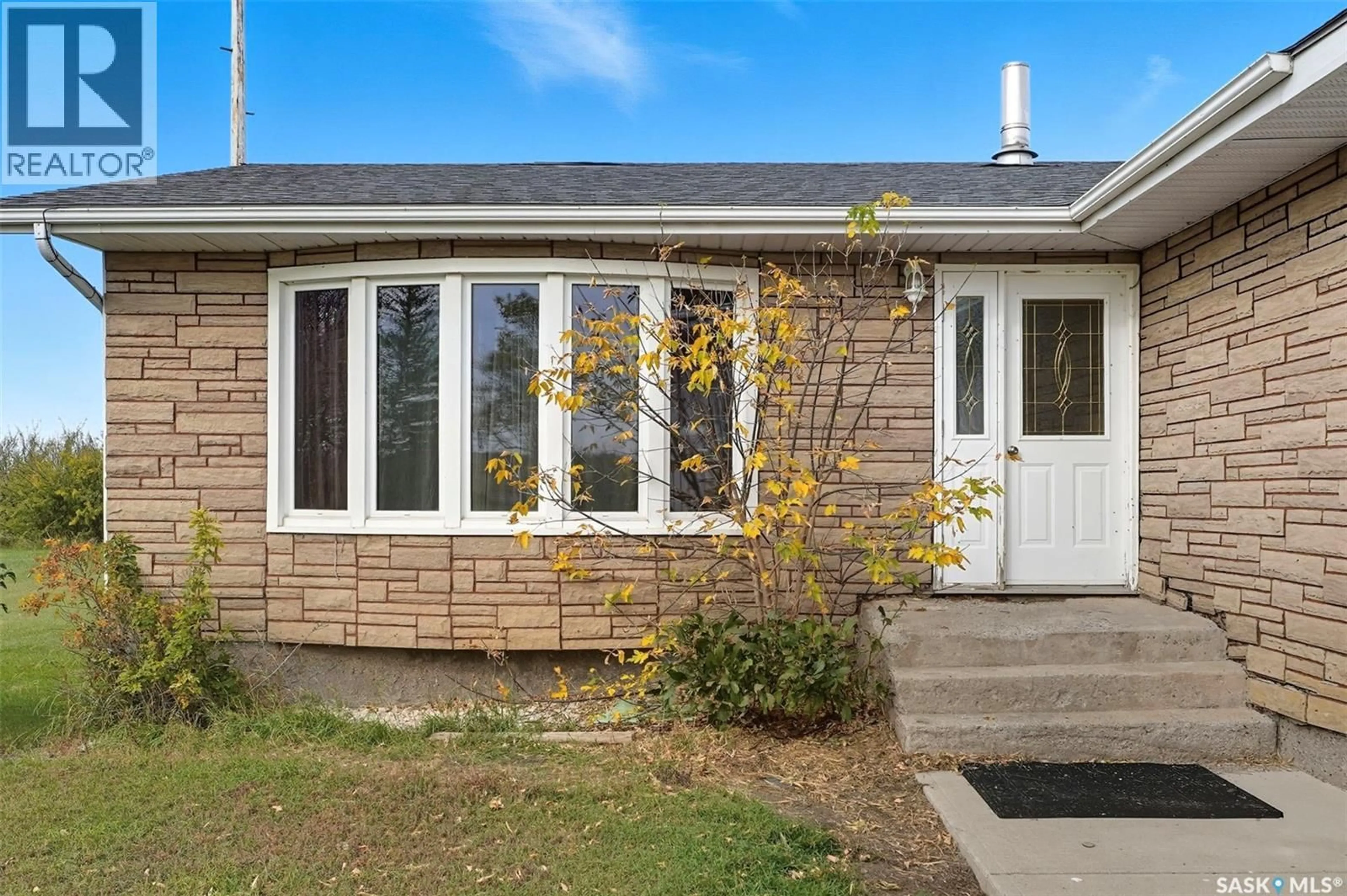 Home with vinyl exterior material, street for DENEIKO ACREAGE, Usborne Rm No. 310 Saskatchewan S0K4T0