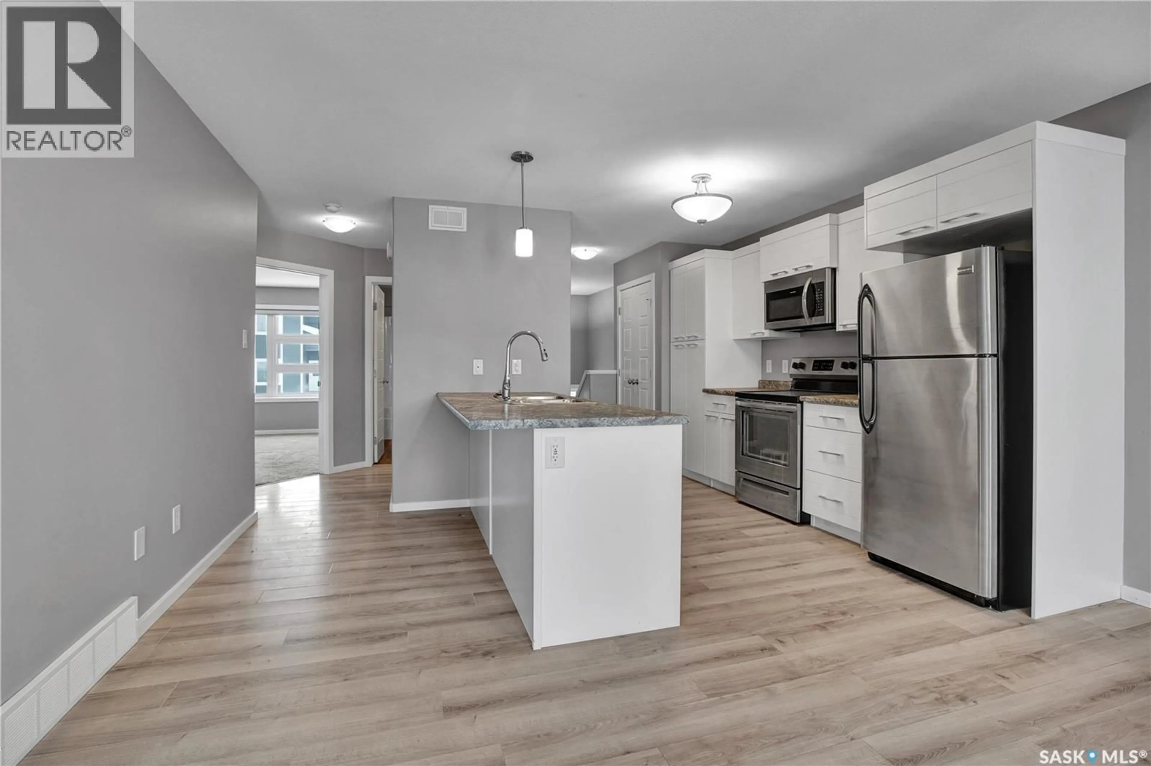 Open concept kitchen, unknown for 104 REDDEKOPP CRESCENT, Warman Saskatchewan S0K4S3