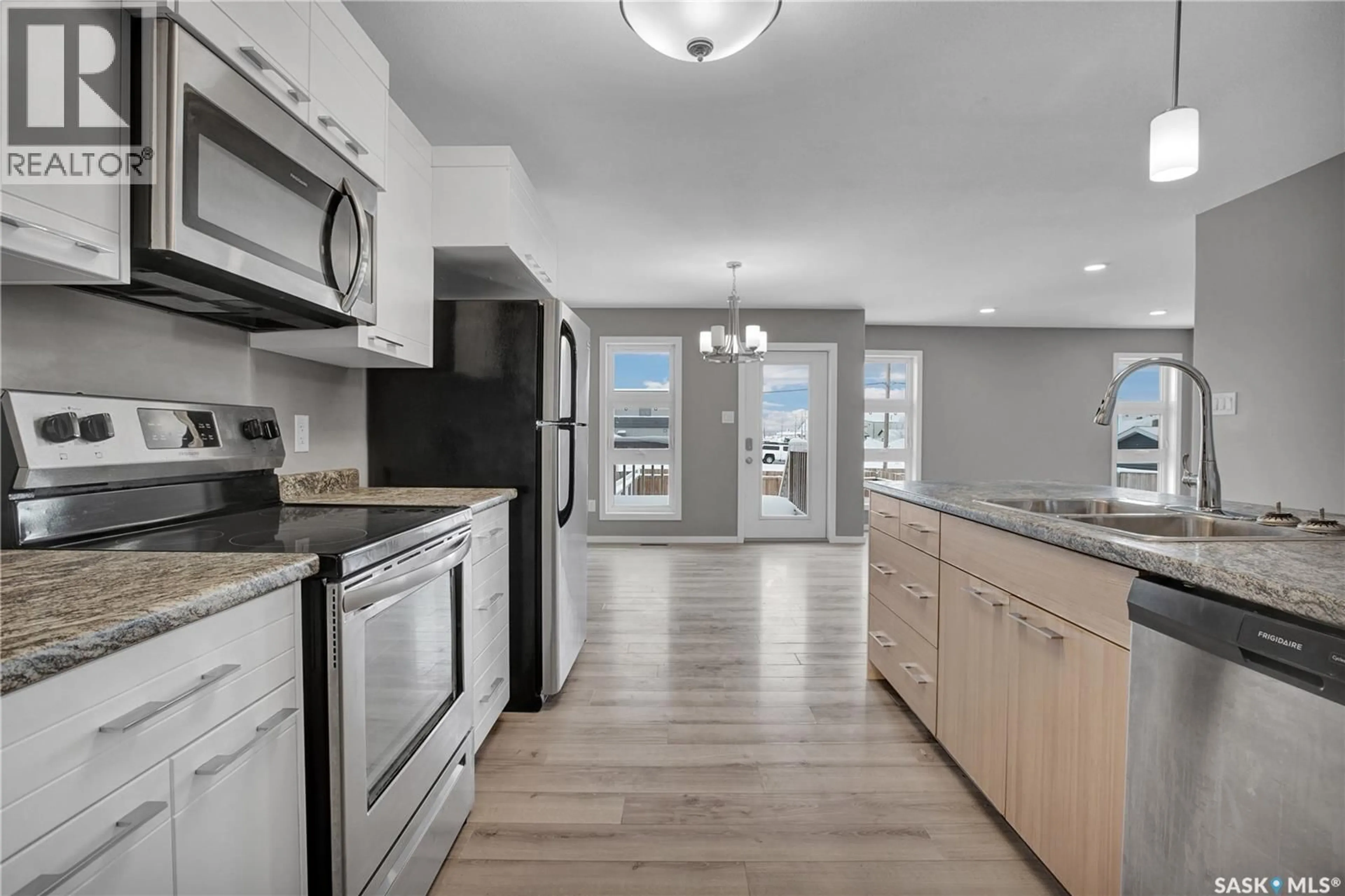 Open concept kitchen, unknown for 104 REDDEKOPP CRESCENT, Warman Saskatchewan S0K4S3