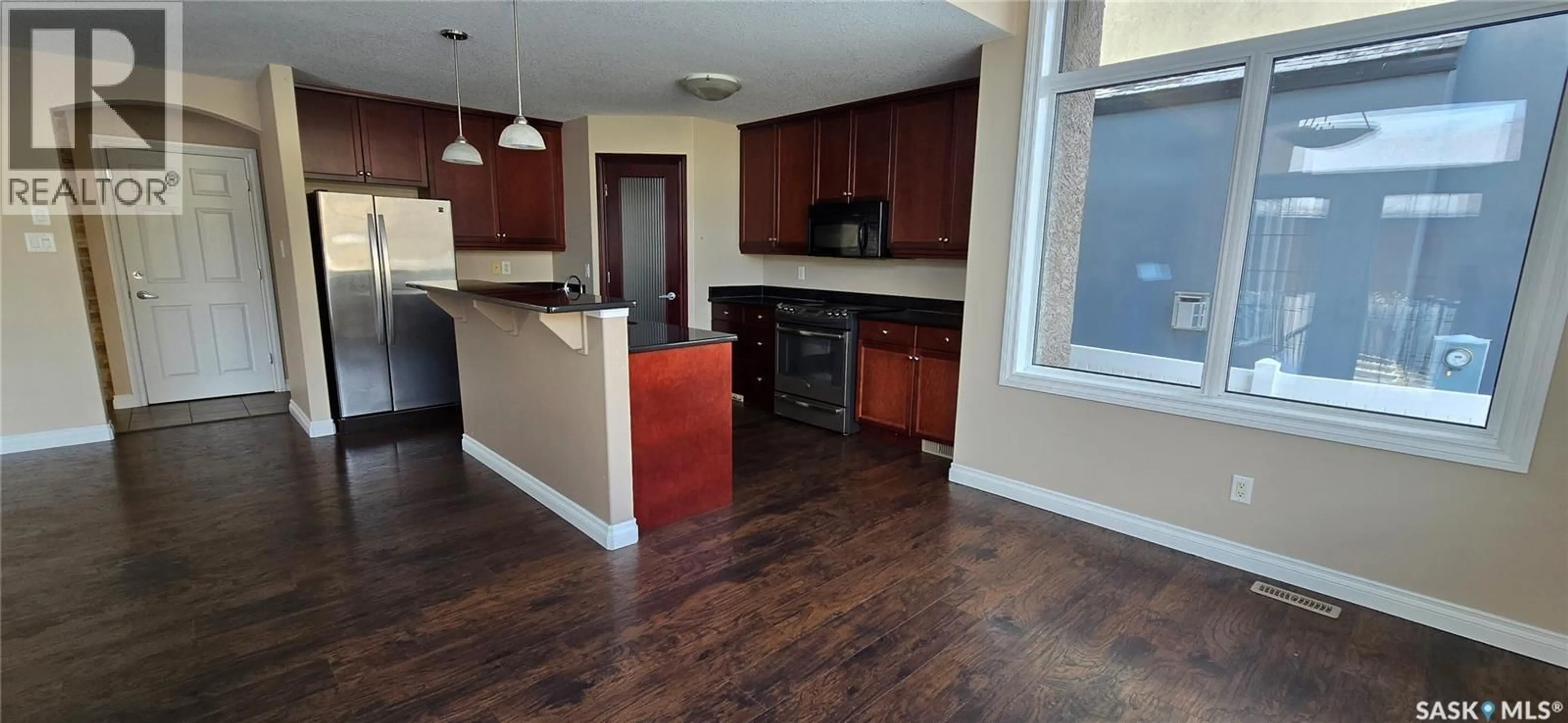 Open concept kitchen, wood/laminate floor for 2523 BRODERICK ROAD, Regina Saskatchewan S4V1K6