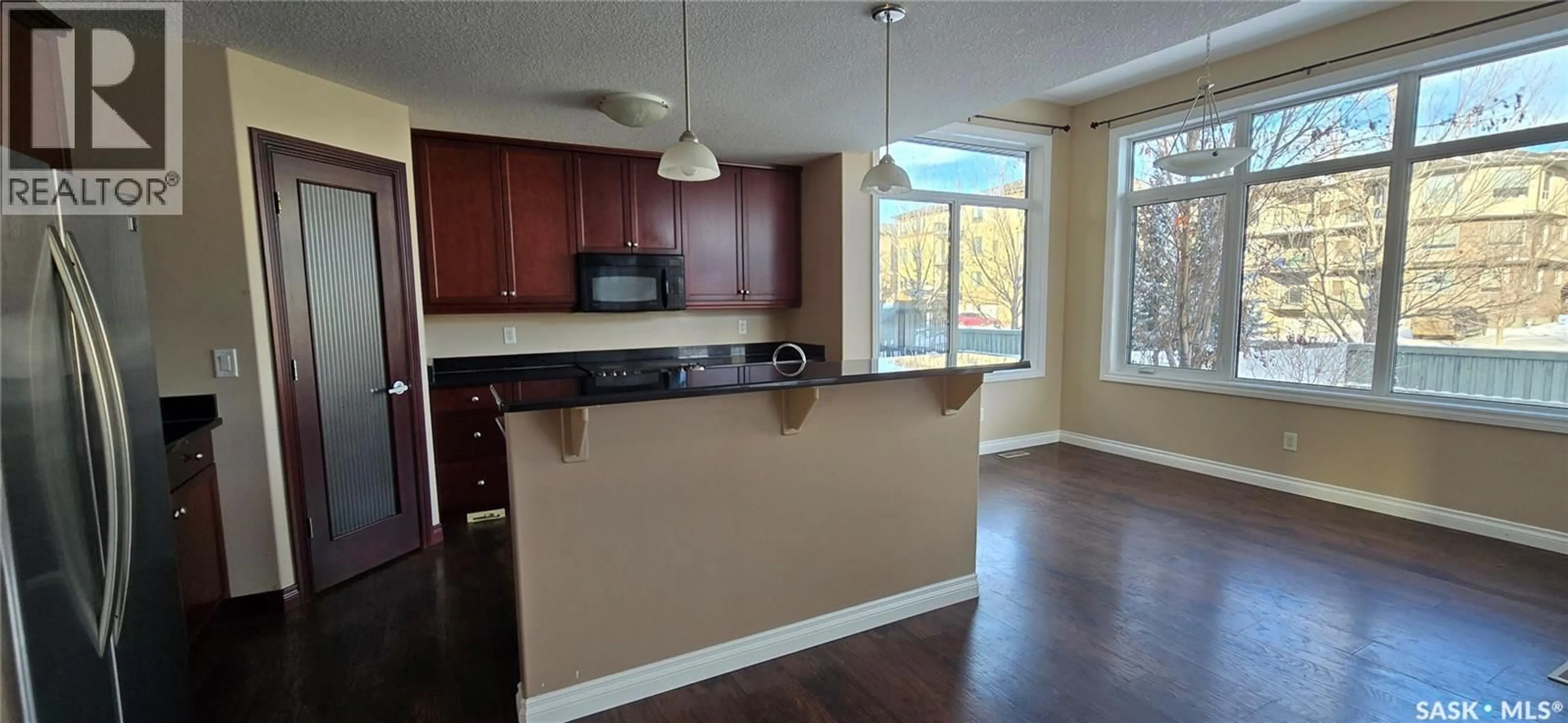 Open concept kitchen, wood/laminate floor for 2523 BRODERICK ROAD, Regina Saskatchewan S4V1K6