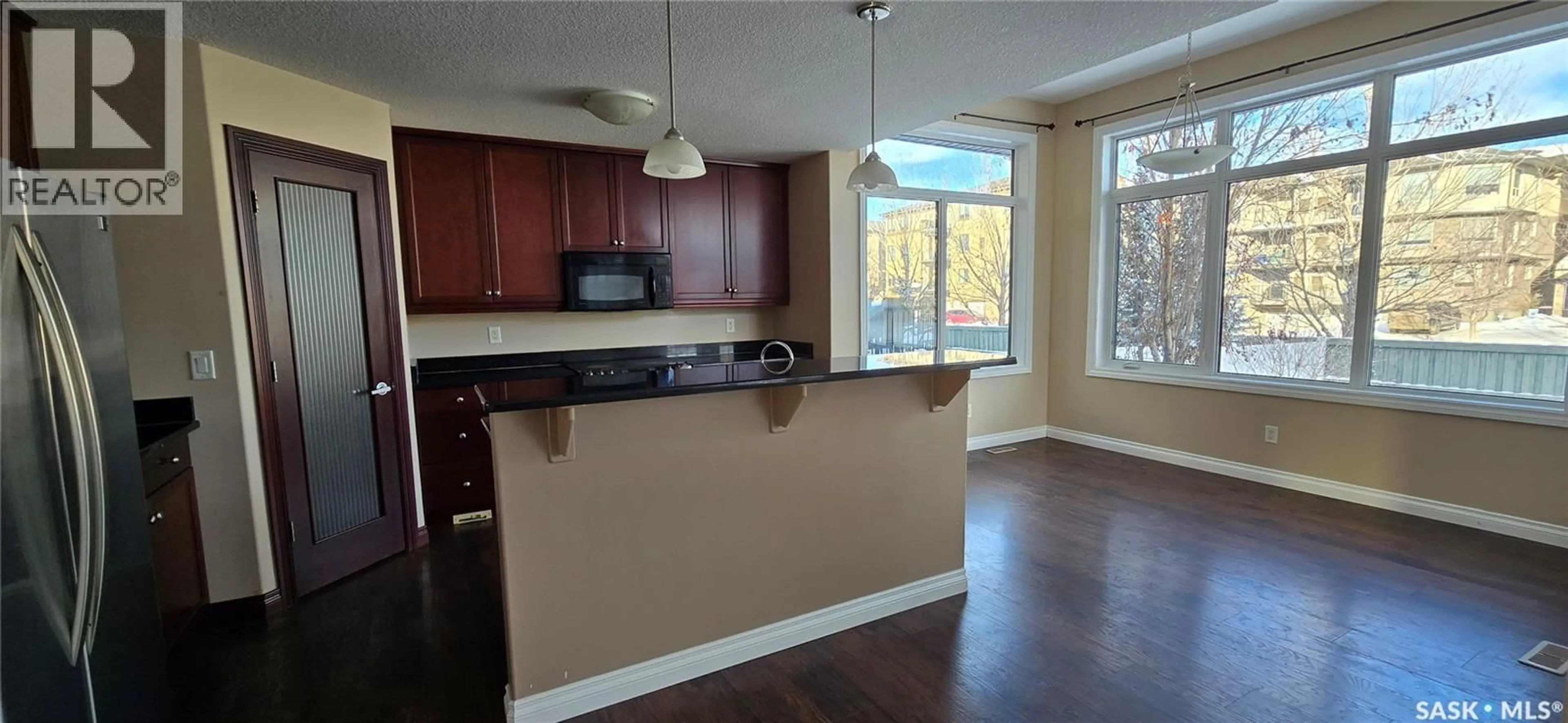 Open concept kitchen, wood/laminate floor for 2523 BRODERICK ROAD, Regina Saskatchewan S4V1K6