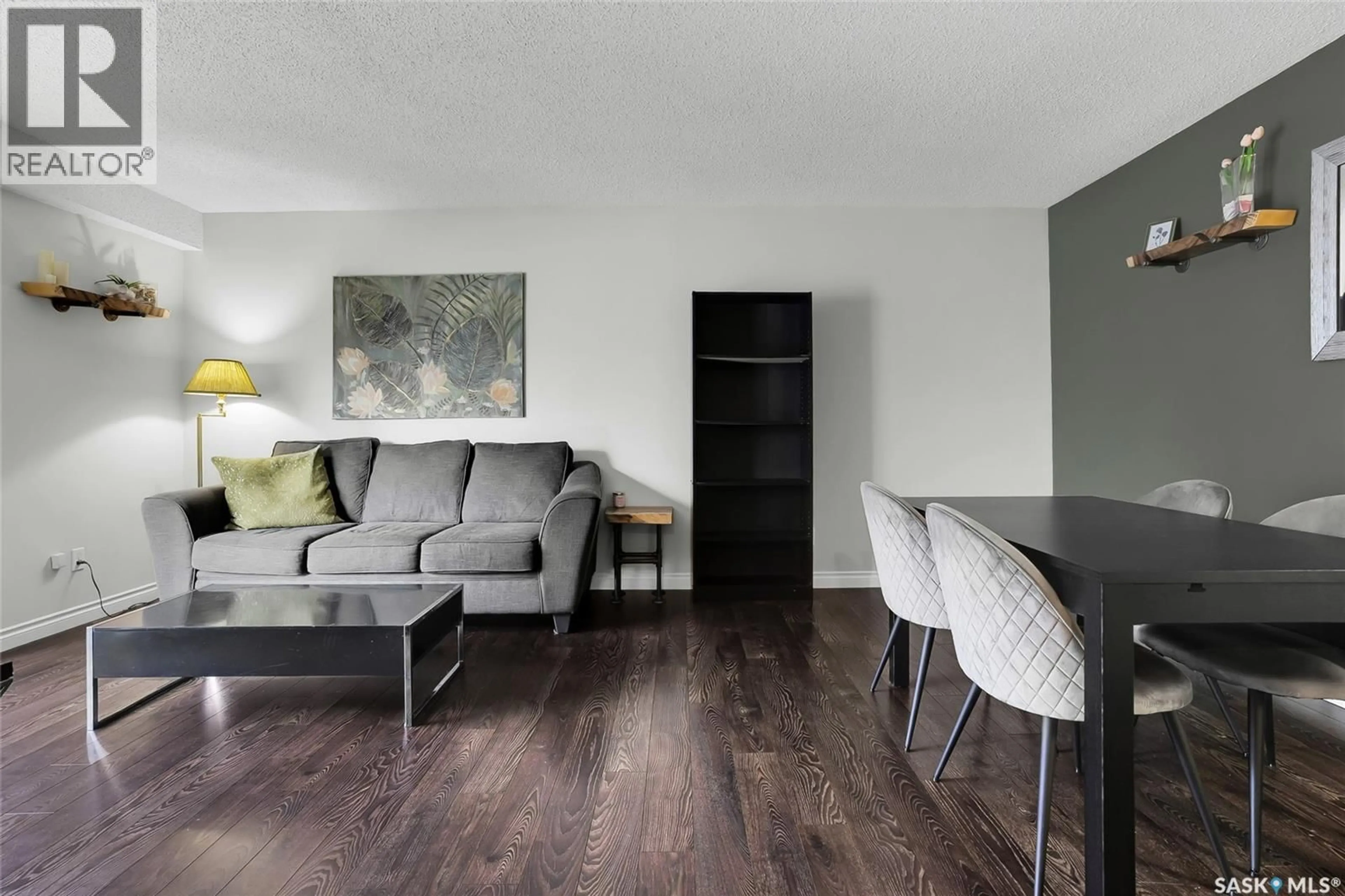 Living room with furniture, wood/laminate floor for 27 215 PRIMROSE DRIVE, Saskatoon Saskatchewan S7K5E4