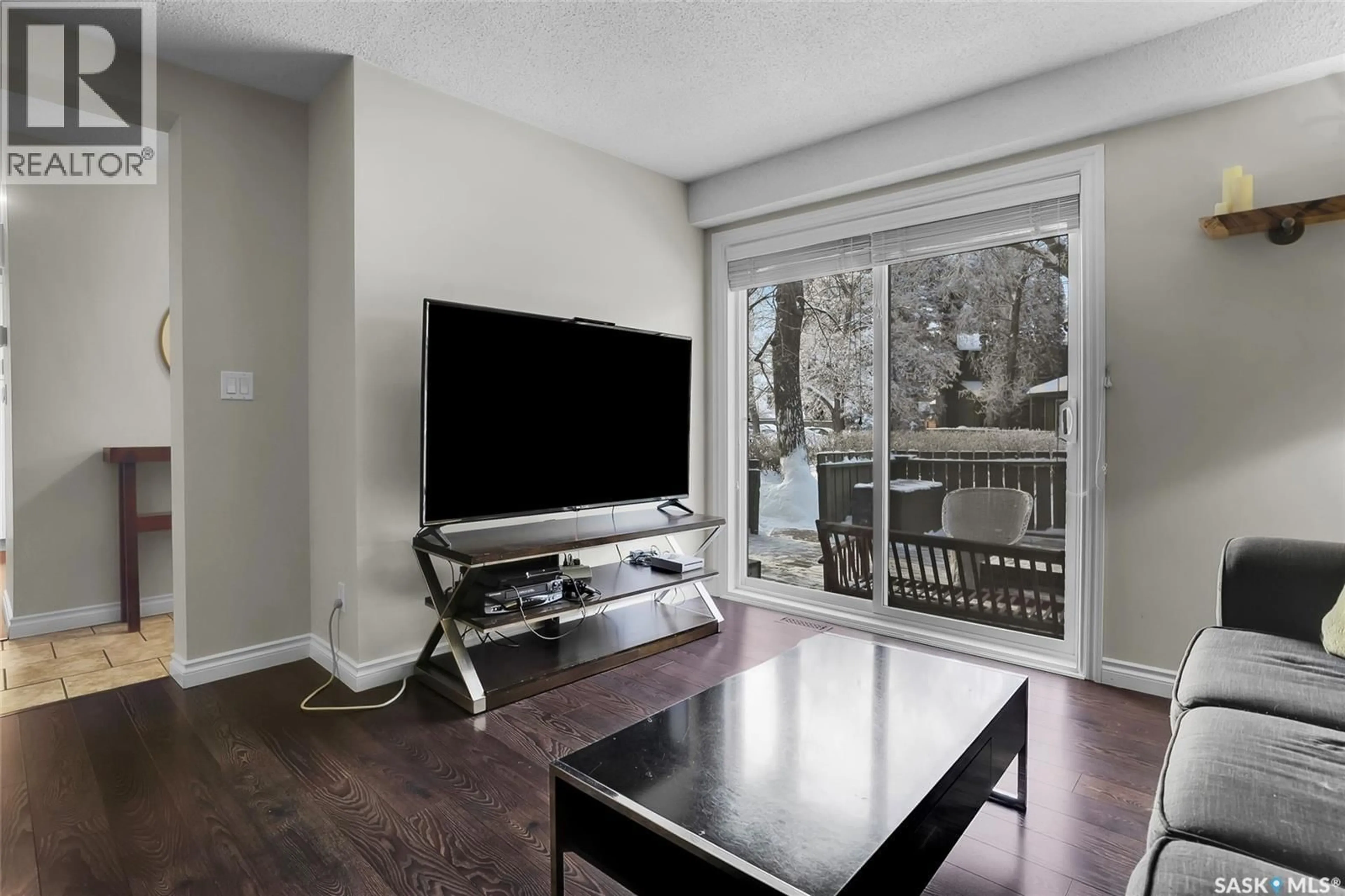 Living room with furniture, wood/laminate floor for 27 215 PRIMROSE DRIVE, Saskatoon Saskatchewan S7K5E4