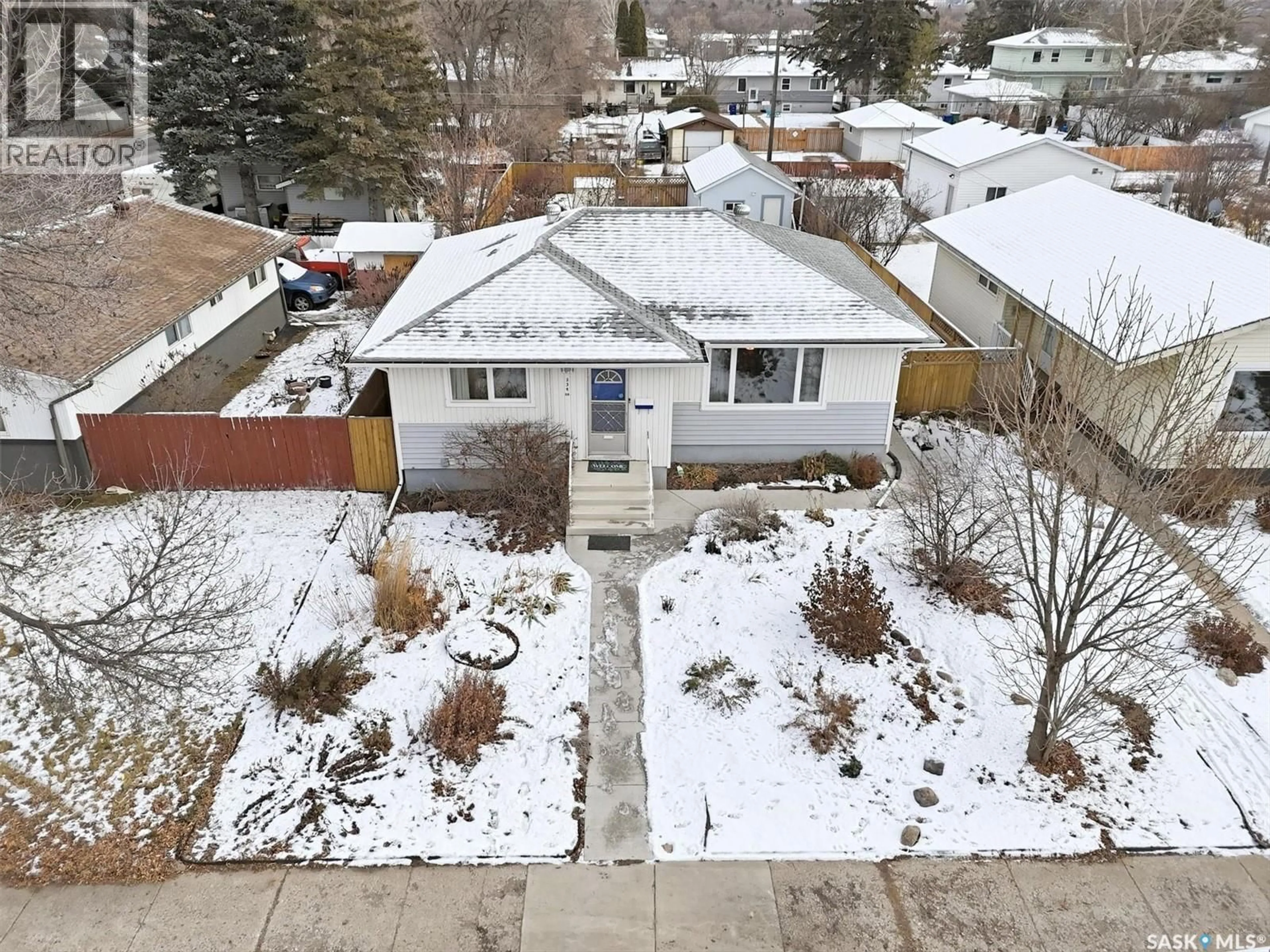 A pic from outside/outdoor area/front of a property/back of a property/a pic from drone, street for 334 Q AVENUE, Saskatoon Saskatchewan S7L2X8