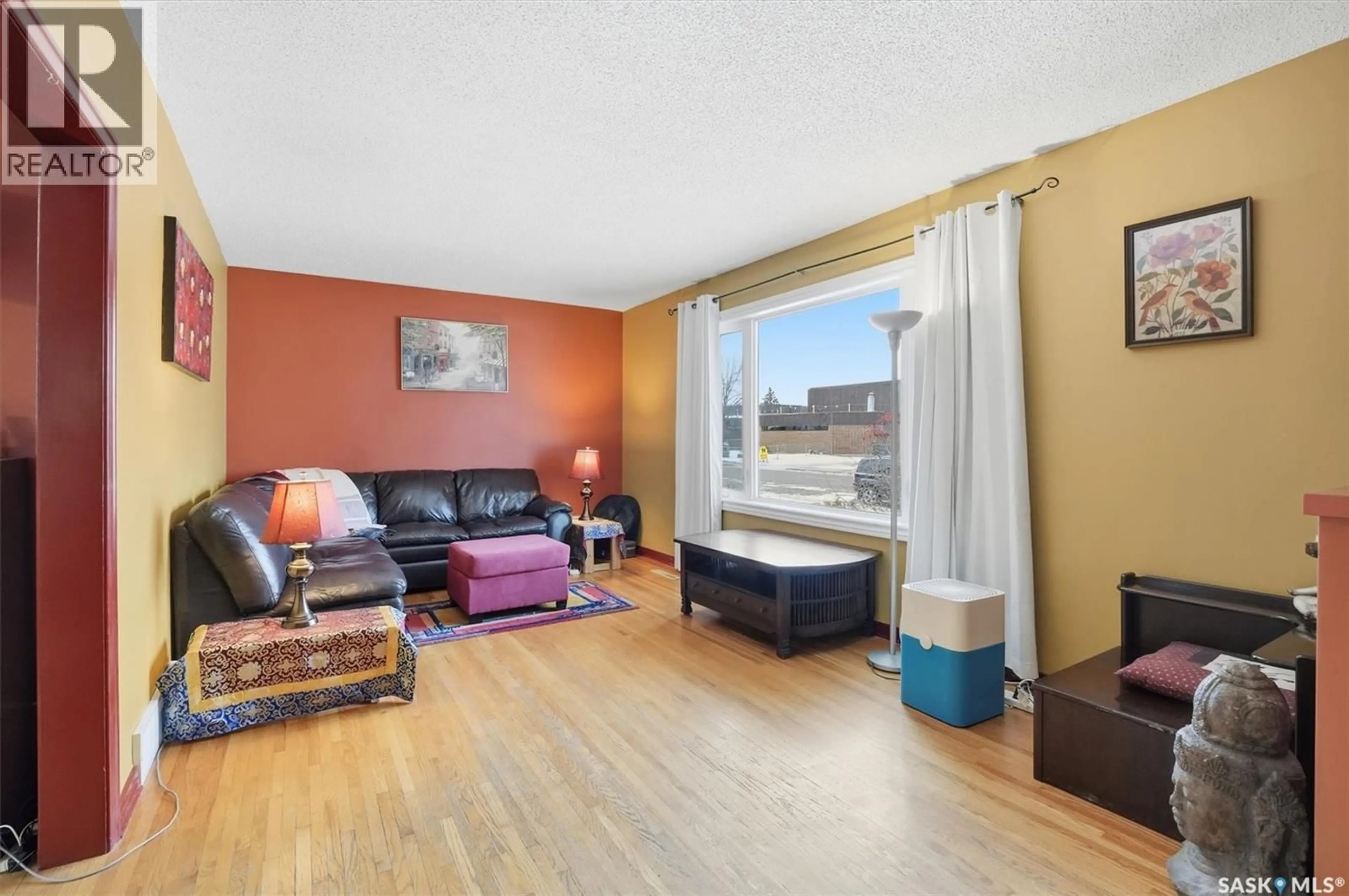 Living room with furniture, wood/laminate floor for 334 Q AVENUE, Saskatoon Saskatchewan S7L2X8