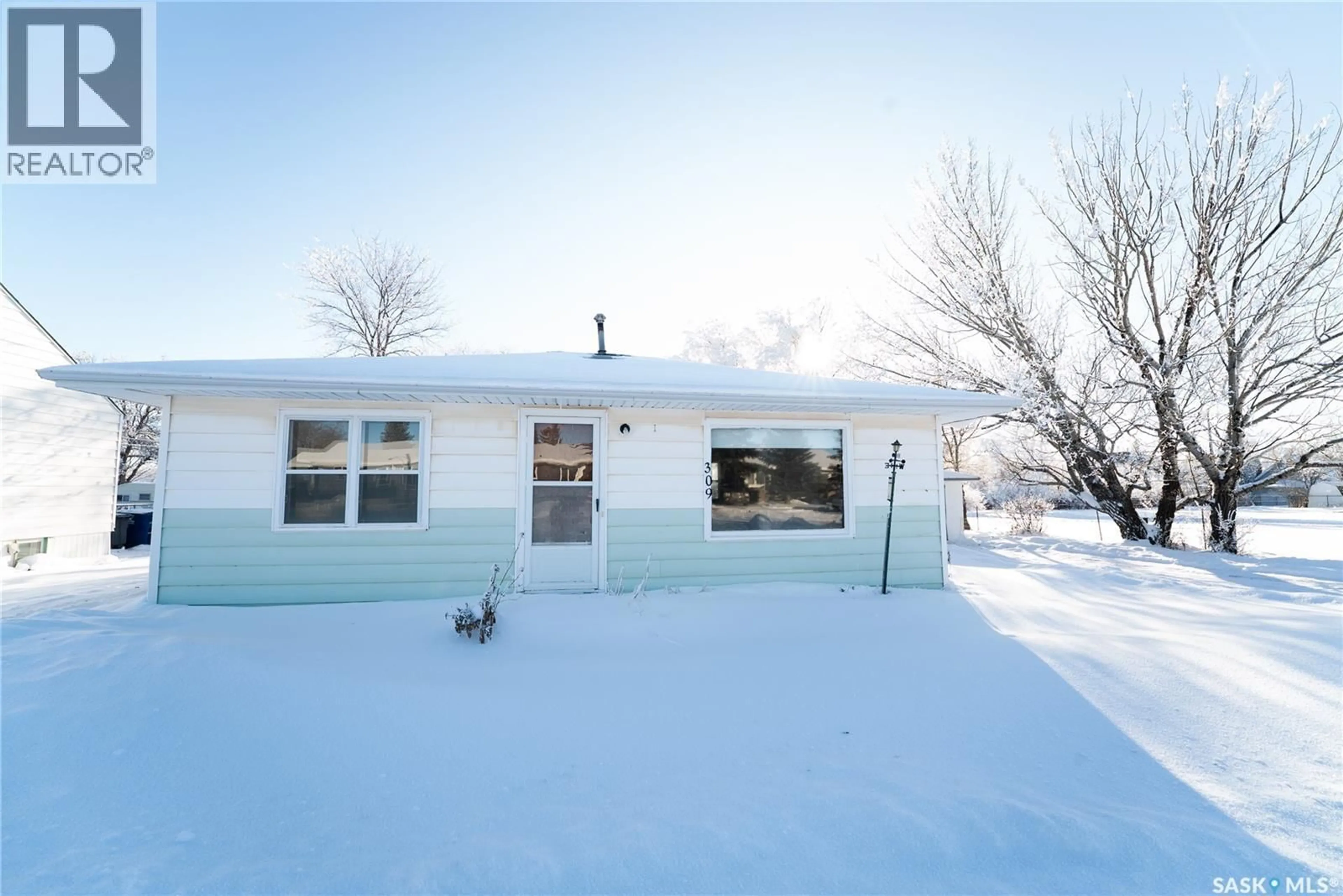 Home with vinyl exterior material, street for 309 GARFIELD AVENUE, Hanley Saskatchewan S0G2E0