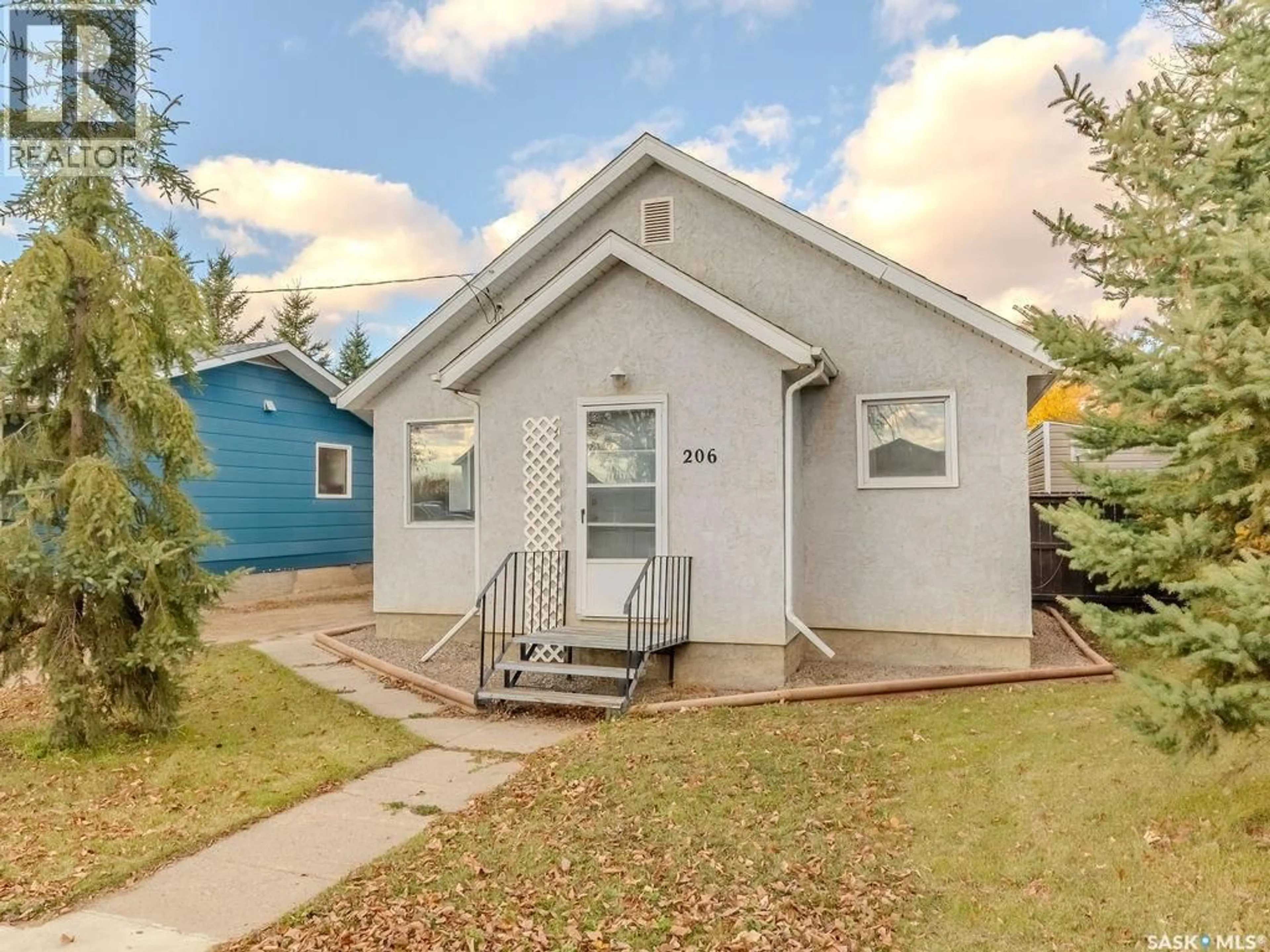 Home with vinyl exterior material, street for 206 1ST STREET, Domremy Saskatchewan S0K1G0