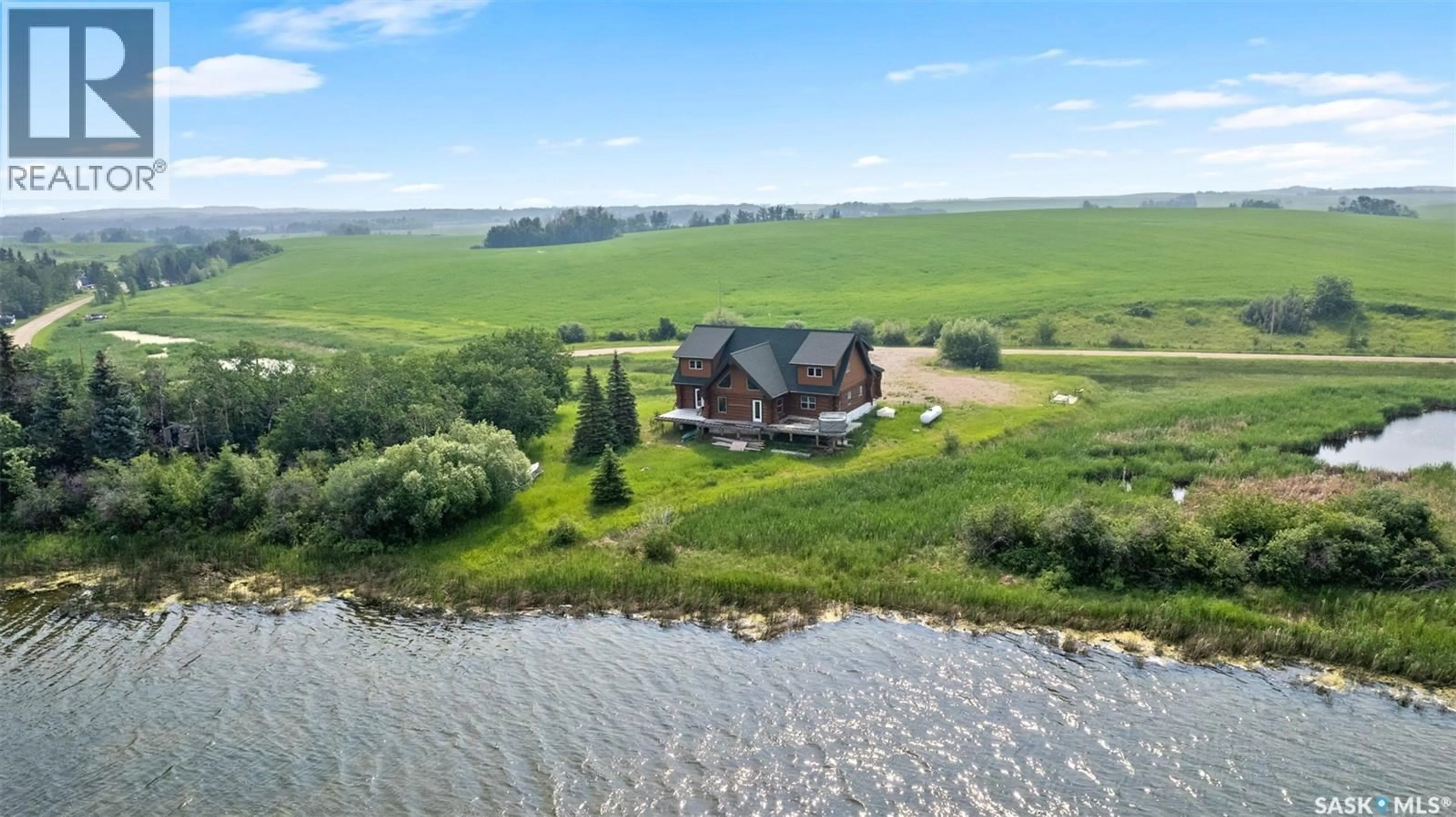 A pic from outside/outdoor area/front of a property/back of a property/a pic from drone, water/lake/river/ocean view for MARTINS LAKE SCENIC WATERFRONT LOG HOME, Leask Rm No. 464 Saskatchewan S0J1M0
