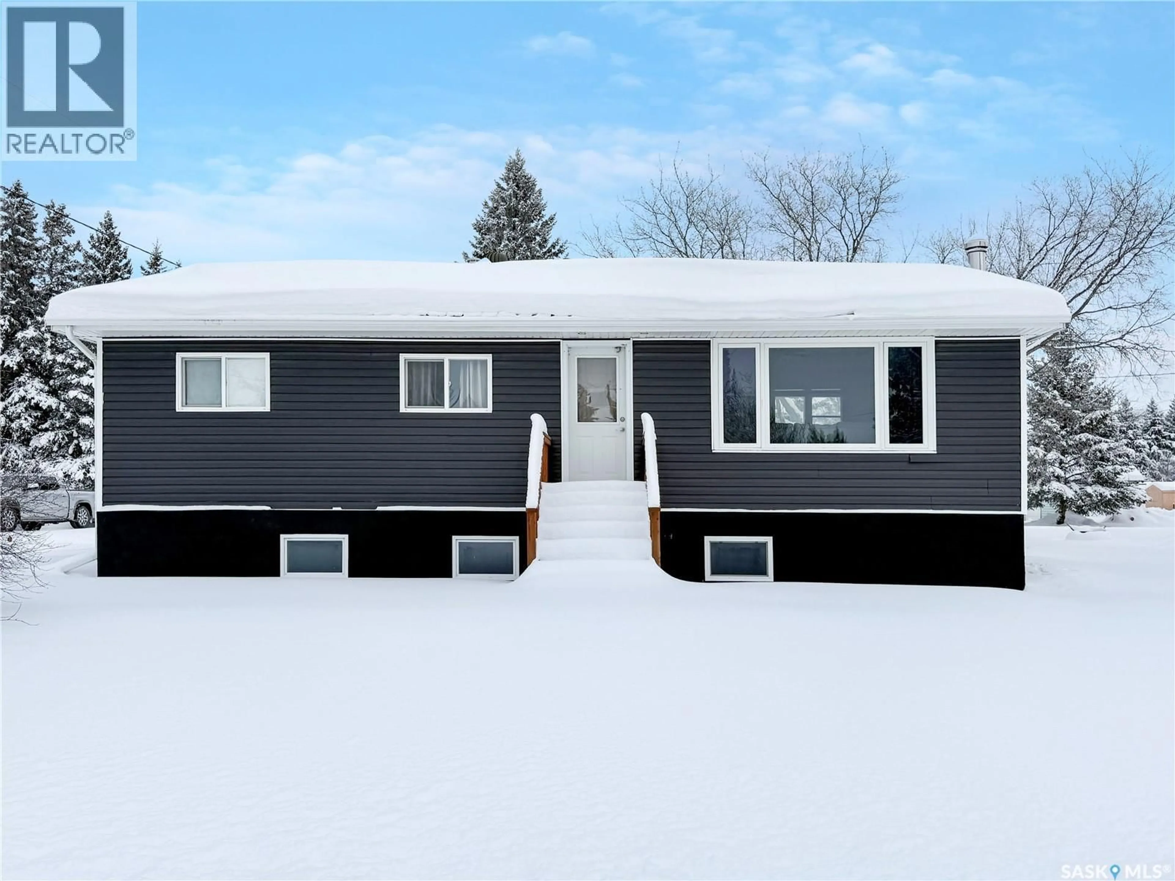 Home with vinyl exterior material, street for 210 1ST STREET, Meath Park Saskatchewan S0J1T0