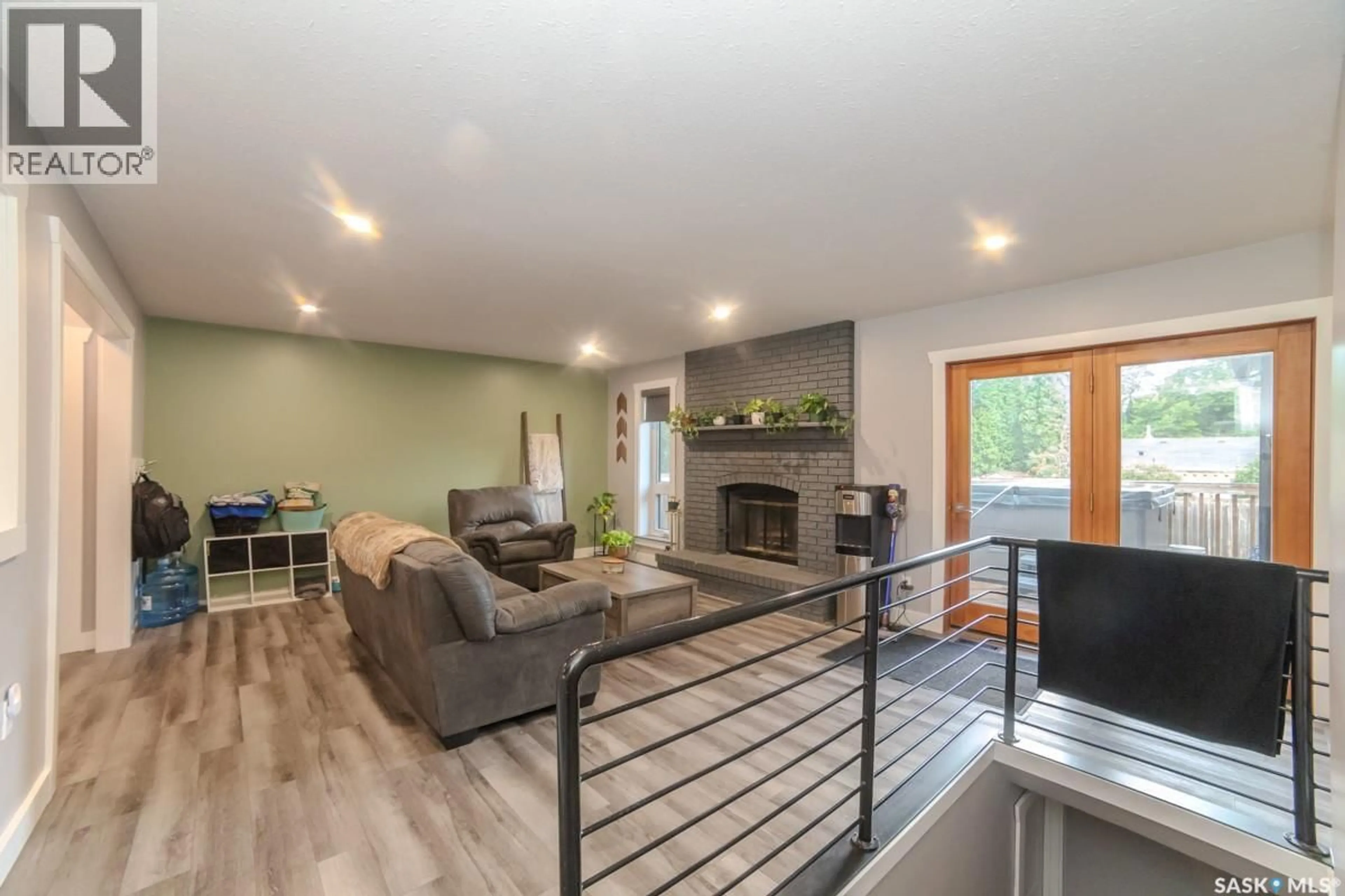 Living room with furniture, wood/laminate floor for 11219 GARDINER DRIVE, North Battleford Saskatchewan S9A3M5