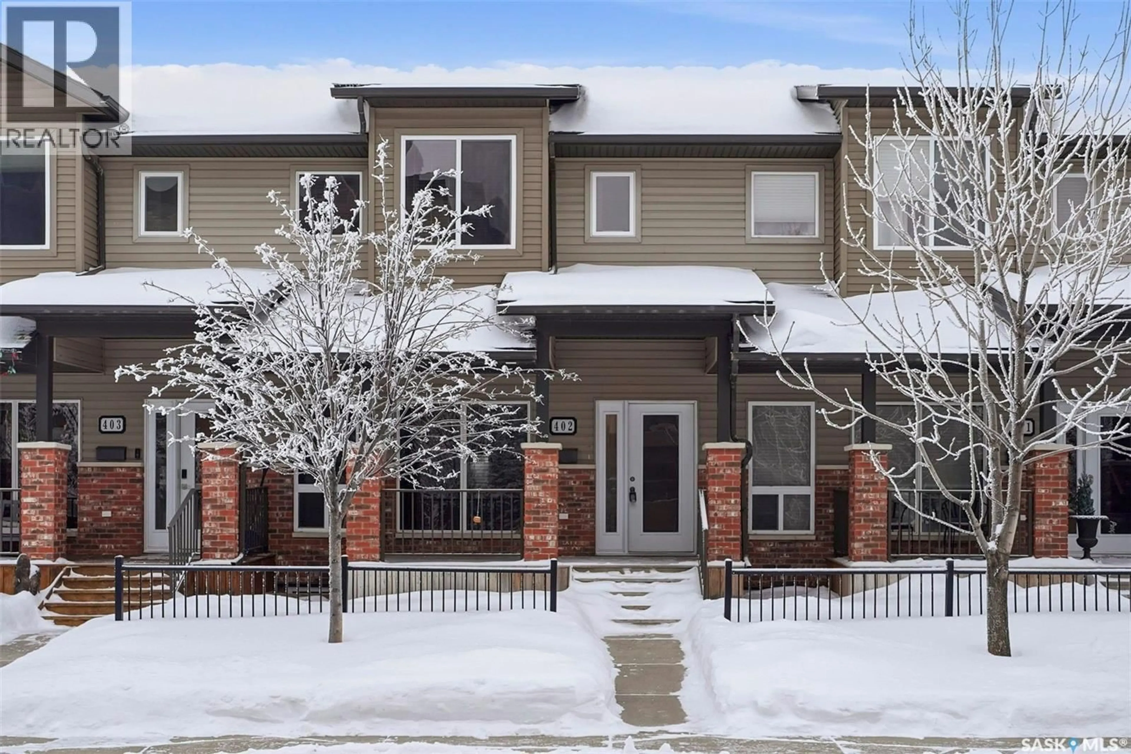 Home with brick exterior material, street for 110 - 402 WILLOWGROVE CRESCENT, Saskatoon Saskatchewan S7W0E3