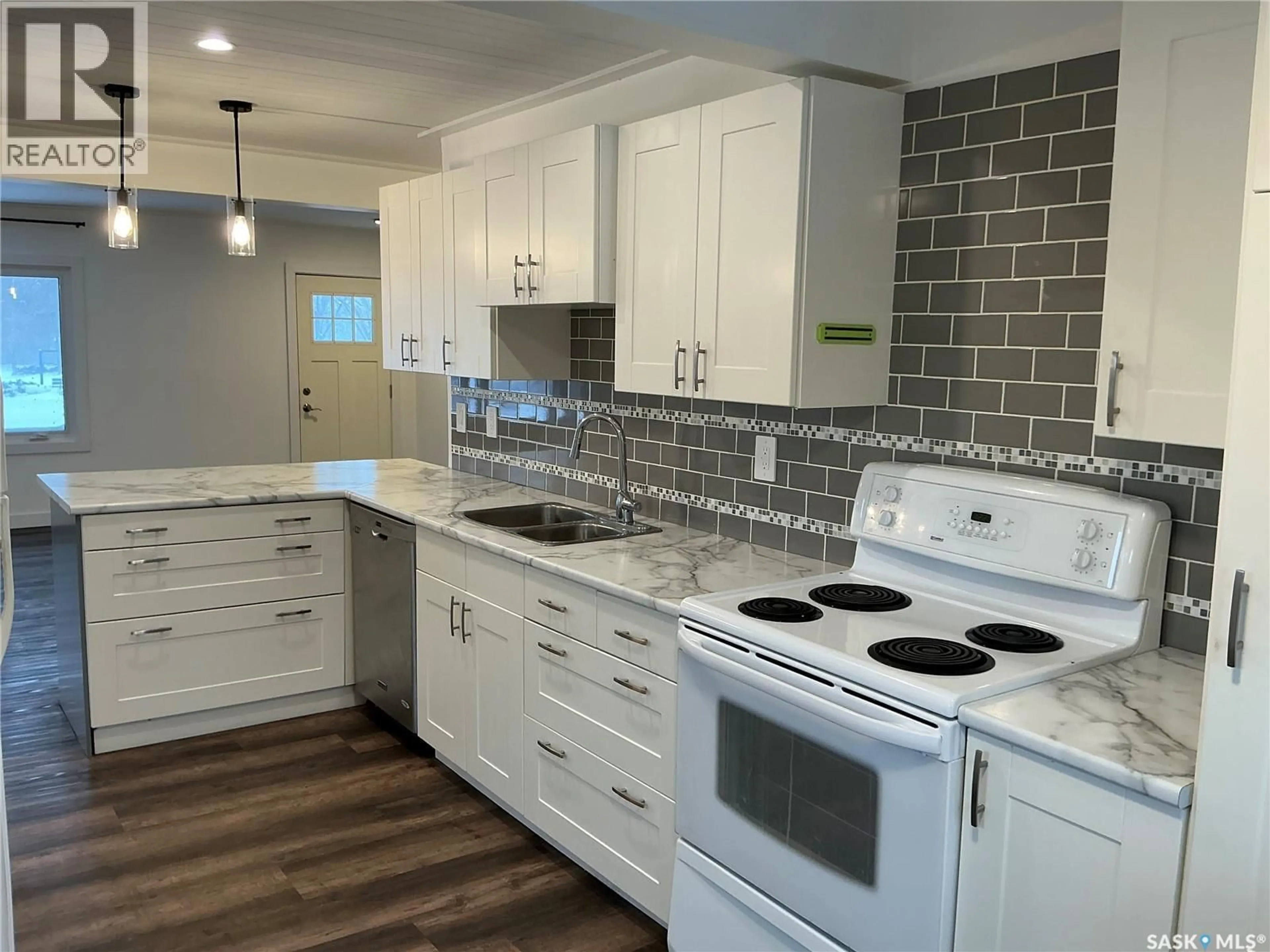 Open concept kitchen, ceramic/tile floor for 2309 HERMAN AVENUE, Saskatoon Saskatchewan S7M0N5