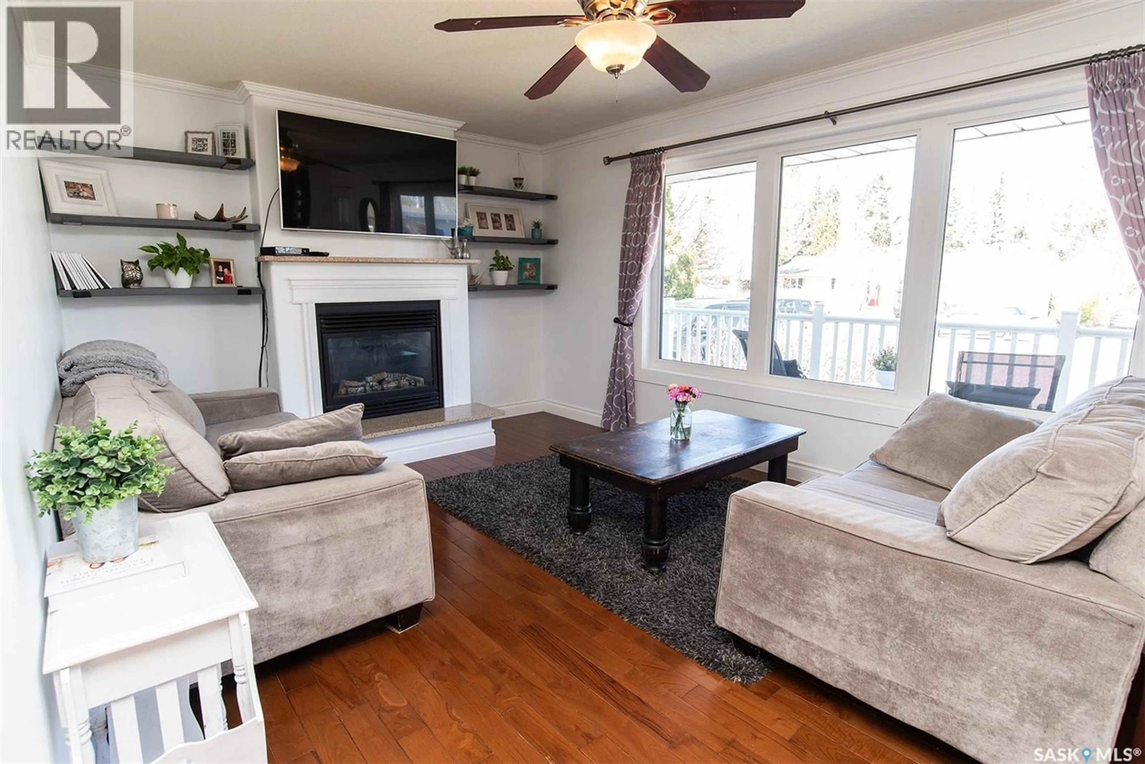 Living room with furniture, wood/laminate floor for 207 BROOKDALE PLACE, Wynyard Saskatchewan S0A4T0