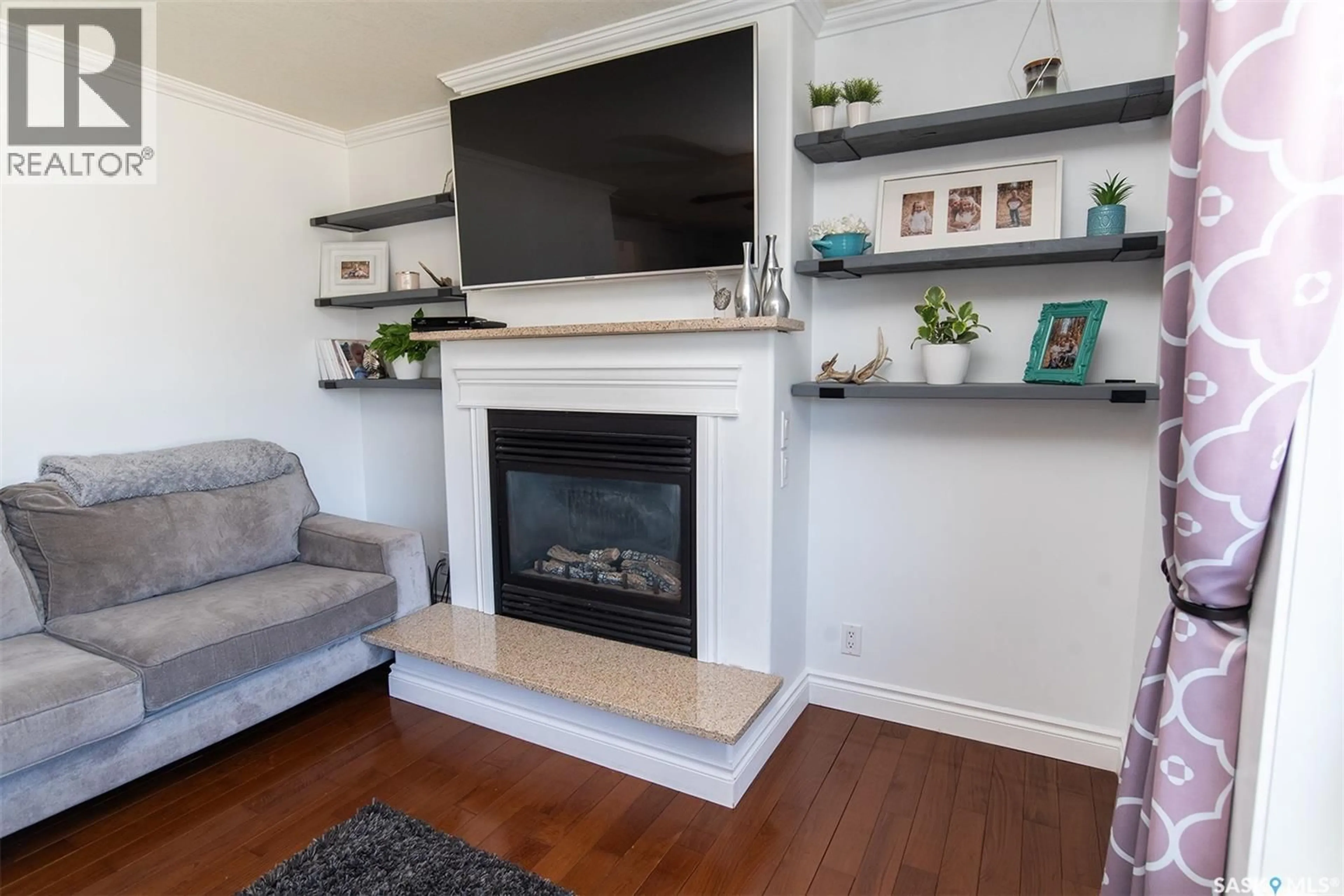 Living room with furniture, wood/laminate floor for 207 BROOKDALE PLACE, Wynyard Saskatchewan S0A4T0