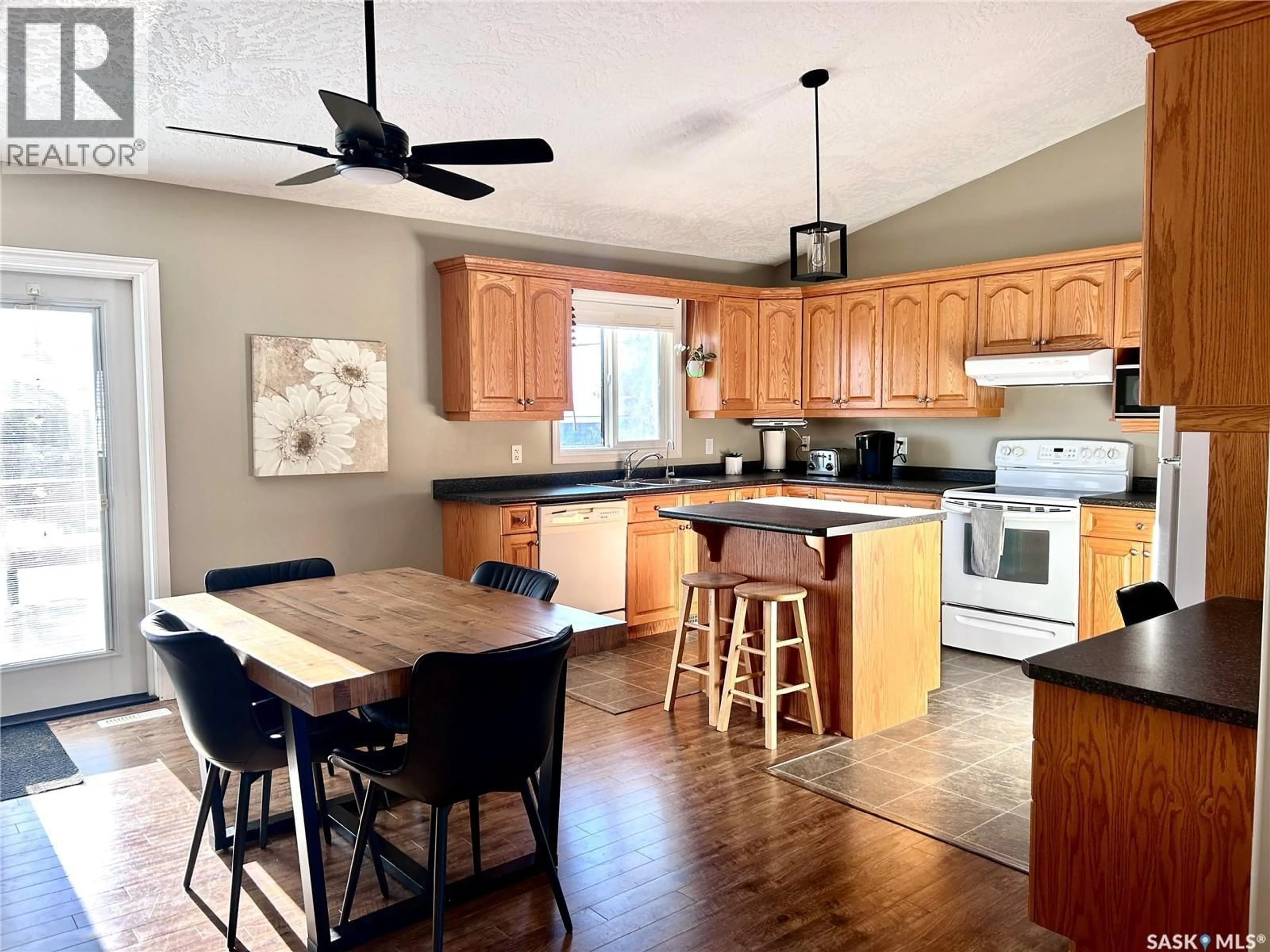 Open concept kitchen, wood/laminate floor for 203 3RD AVENUE, Shellbrook Saskatchewan S0J2E0