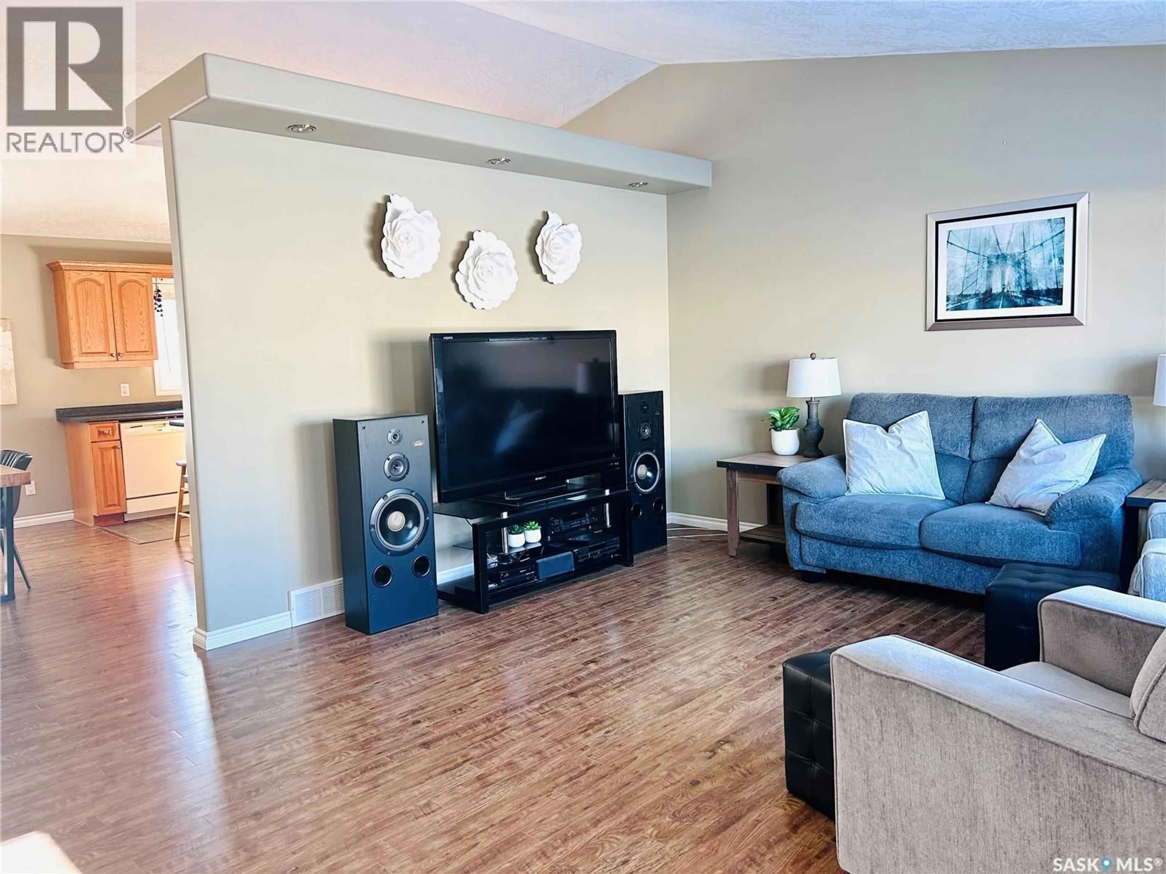 Living room with furniture, wood/laminate floor for 203 3RD AVENUE, Shellbrook Saskatchewan S0J2E0