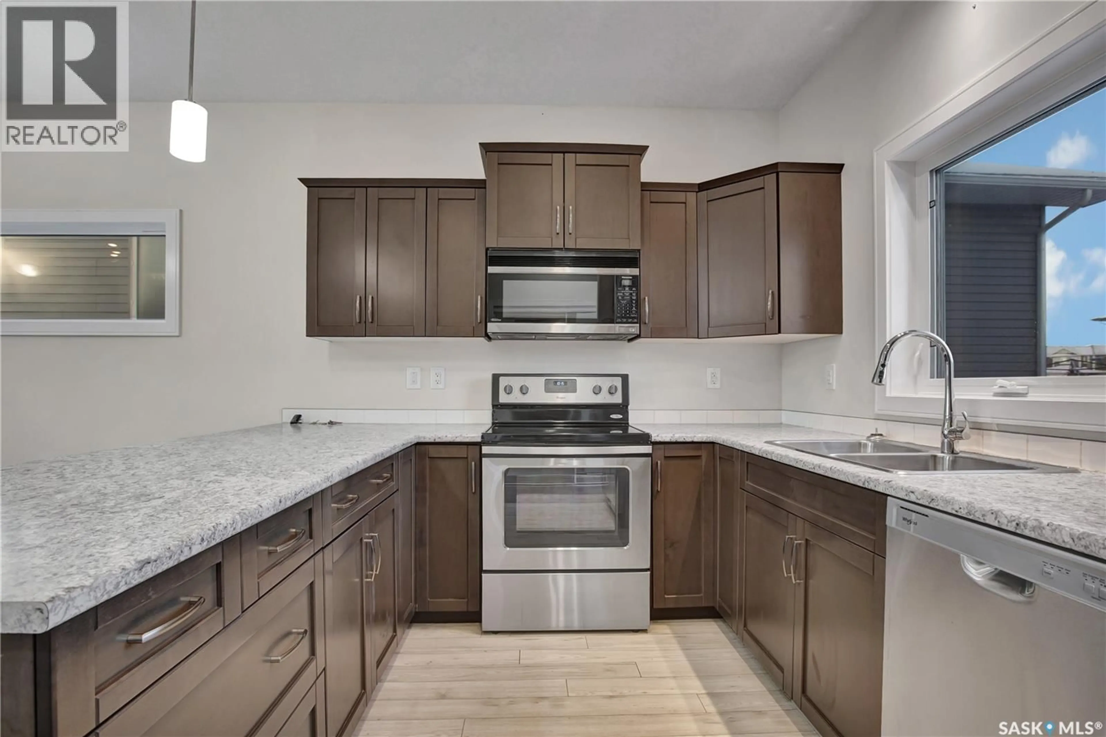 Open concept kitchen, ceramic/tile floor for 1069 PARR HILL DRIVE, Martensville Saskatchewan S0K2T1