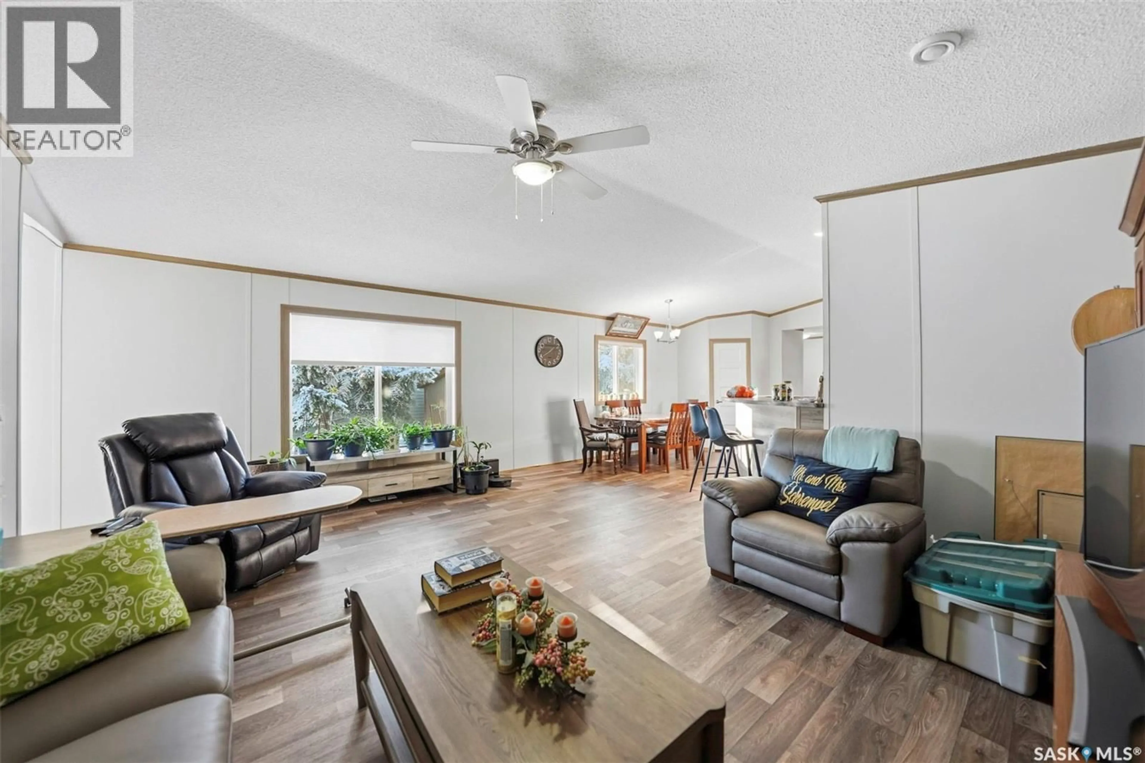 Living room with furniture, wood/laminate floor for 57 MULBERRY ROAD, Blucher Rm No. 343 Saskatchewan S7B0A4