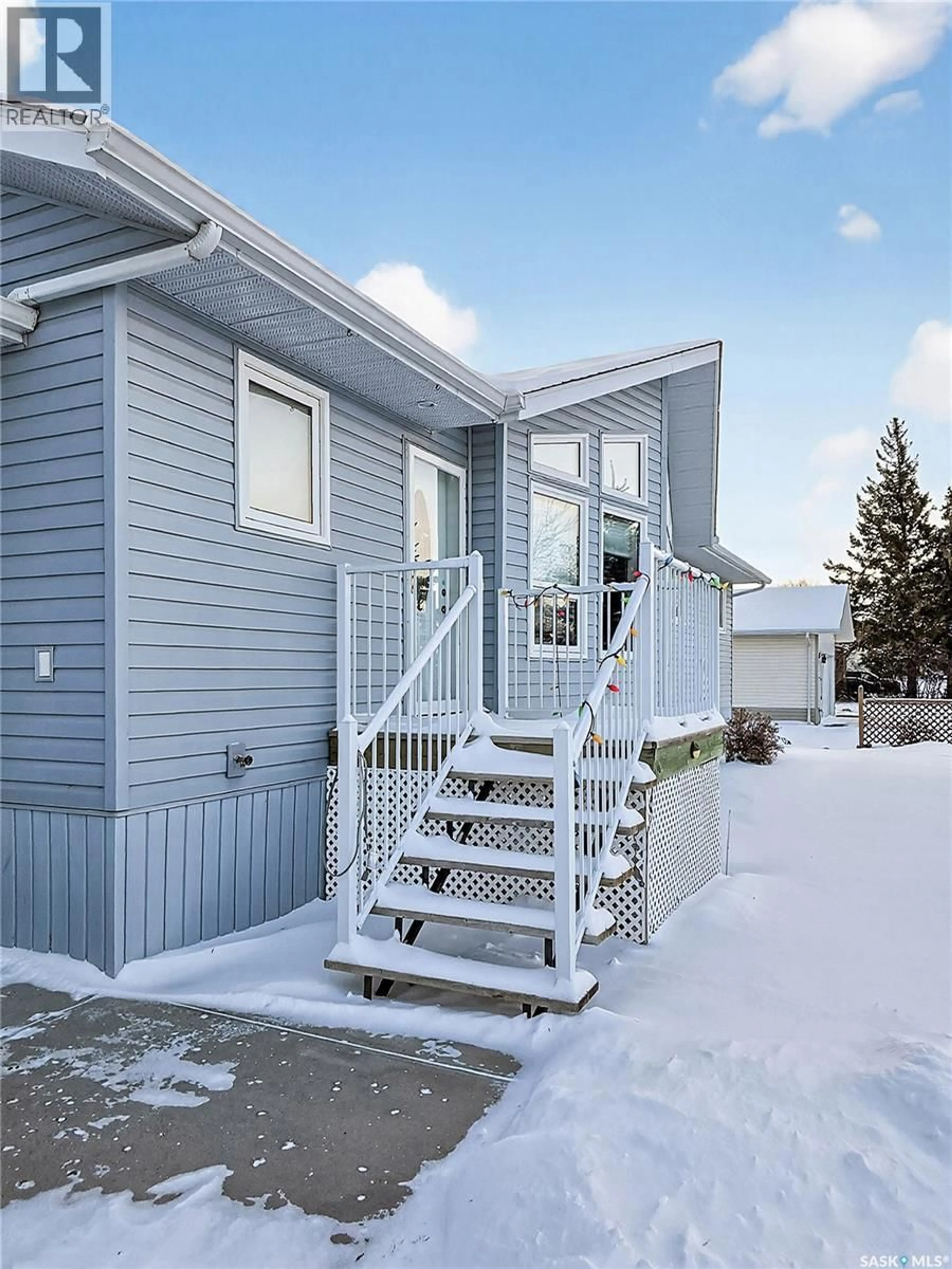 Home with vinyl exterior material, street for 105 NELSON AVENUE, Kipling Saskatchewan S0G2S0