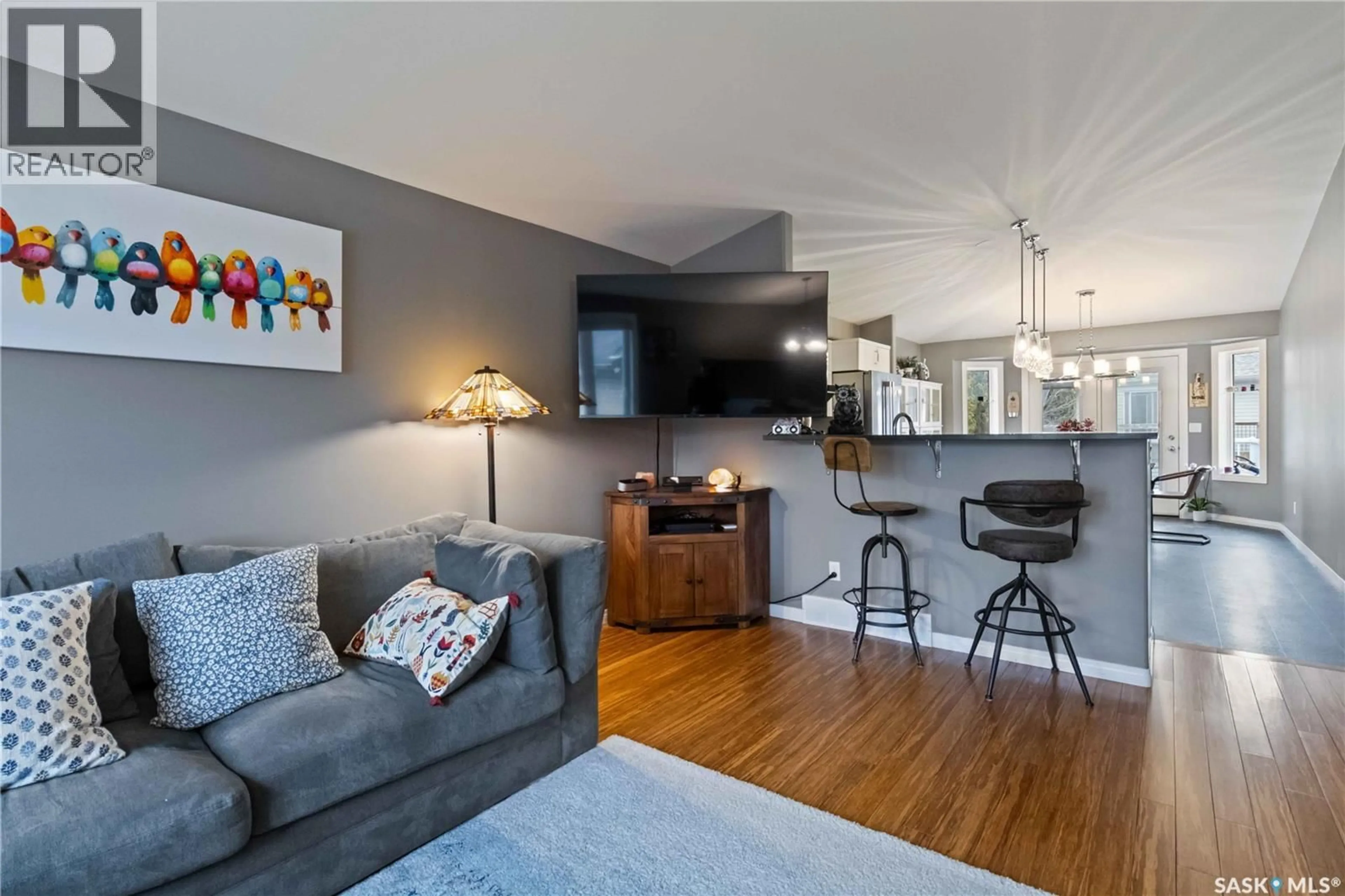 Living room with furniture, wood/laminate floor for 506 KUCEY CRESCENT, Saskatoon Saskatchewan S7N4T3