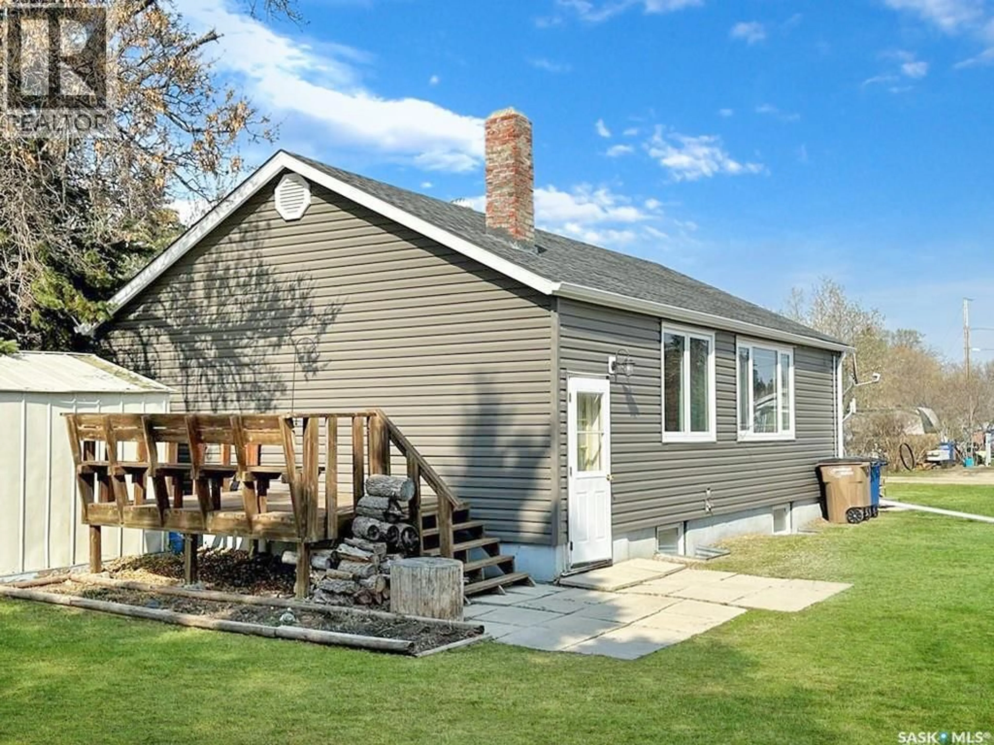 Home with vinyl exterior material, street for 103 1ST STREET, Meath Park Saskatchewan S0J1T0